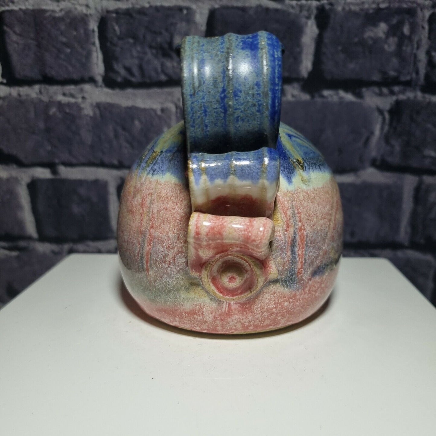 A Studio Pottery Vase with Scrolled Handle with unknown makers mark.