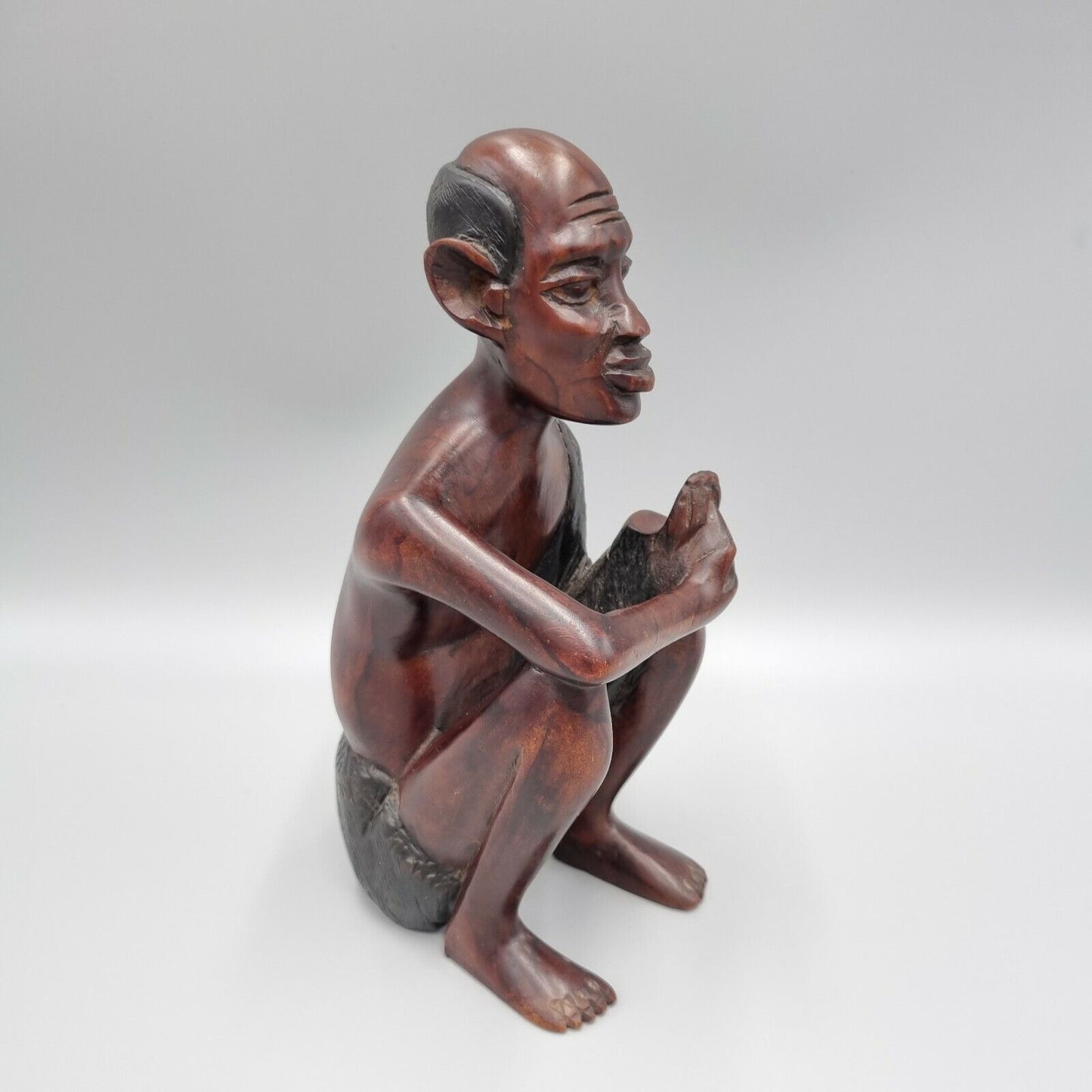 A Vintage Carved Dark Hard Wood African Seated Figure. VGC.