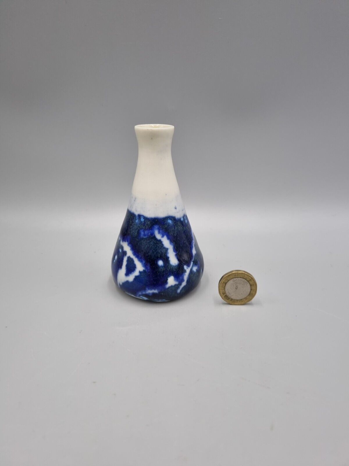 A Studio Pottery Blue & White Ceramic Conical Bud  Posy Vase. Signed 'R'.