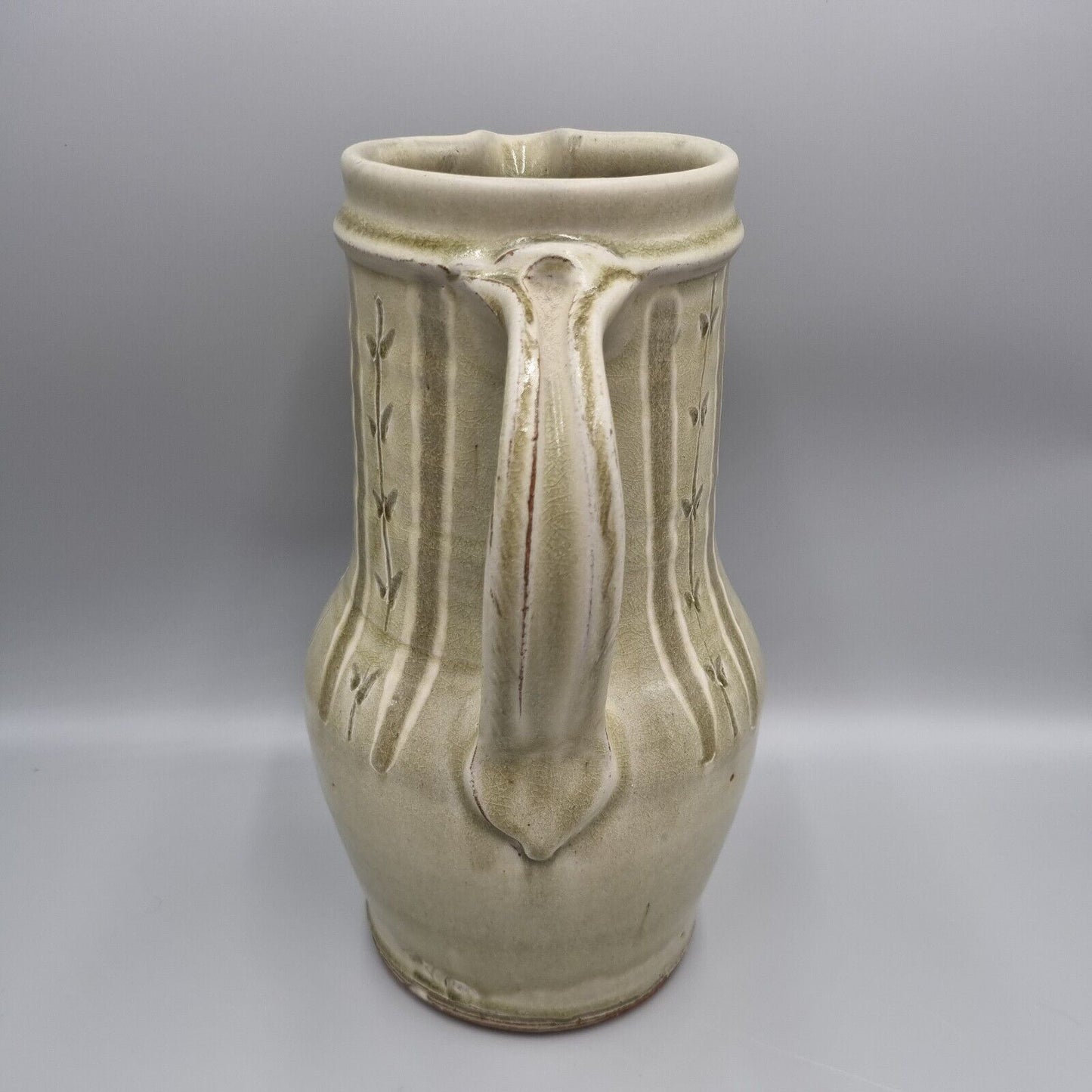 A Large Jug by Mike Dodd In Green Ash Glaze With Incised Motifs. VGC.