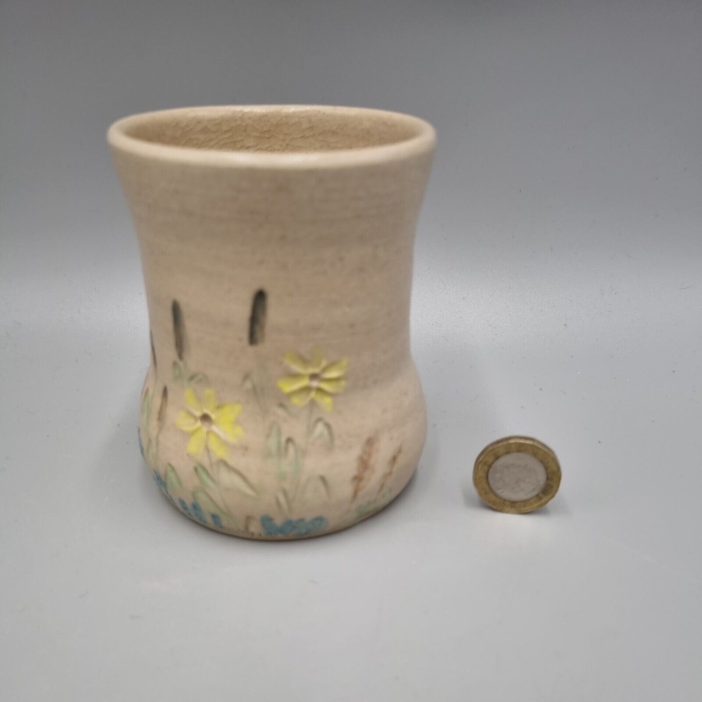 A Studio Pottery Vase With Impressed Flower Decoration, Marked To Base.