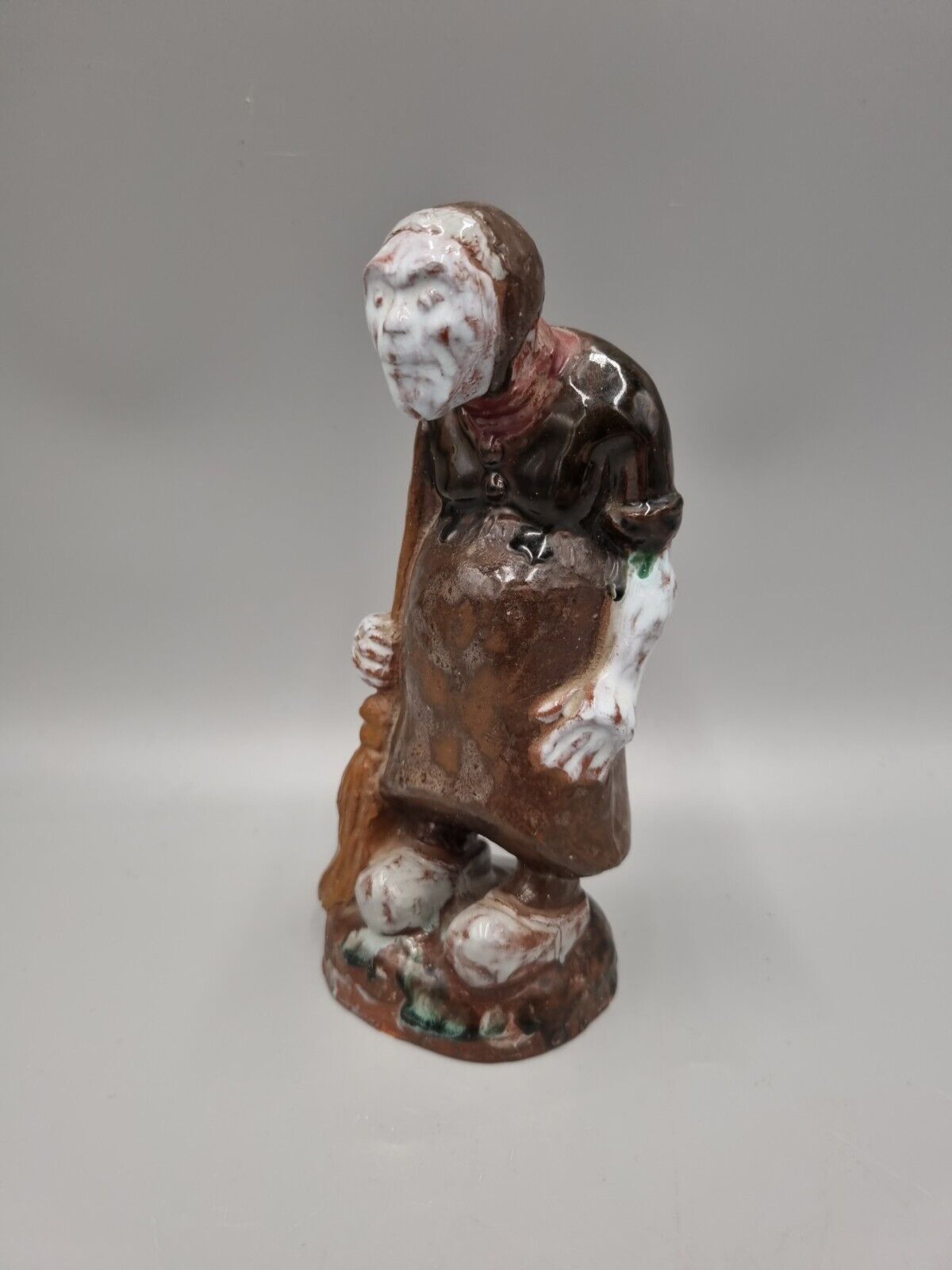 A Handmade Studio Pottery Figurine Of A Woman In Clogs, Fish markers Mark.