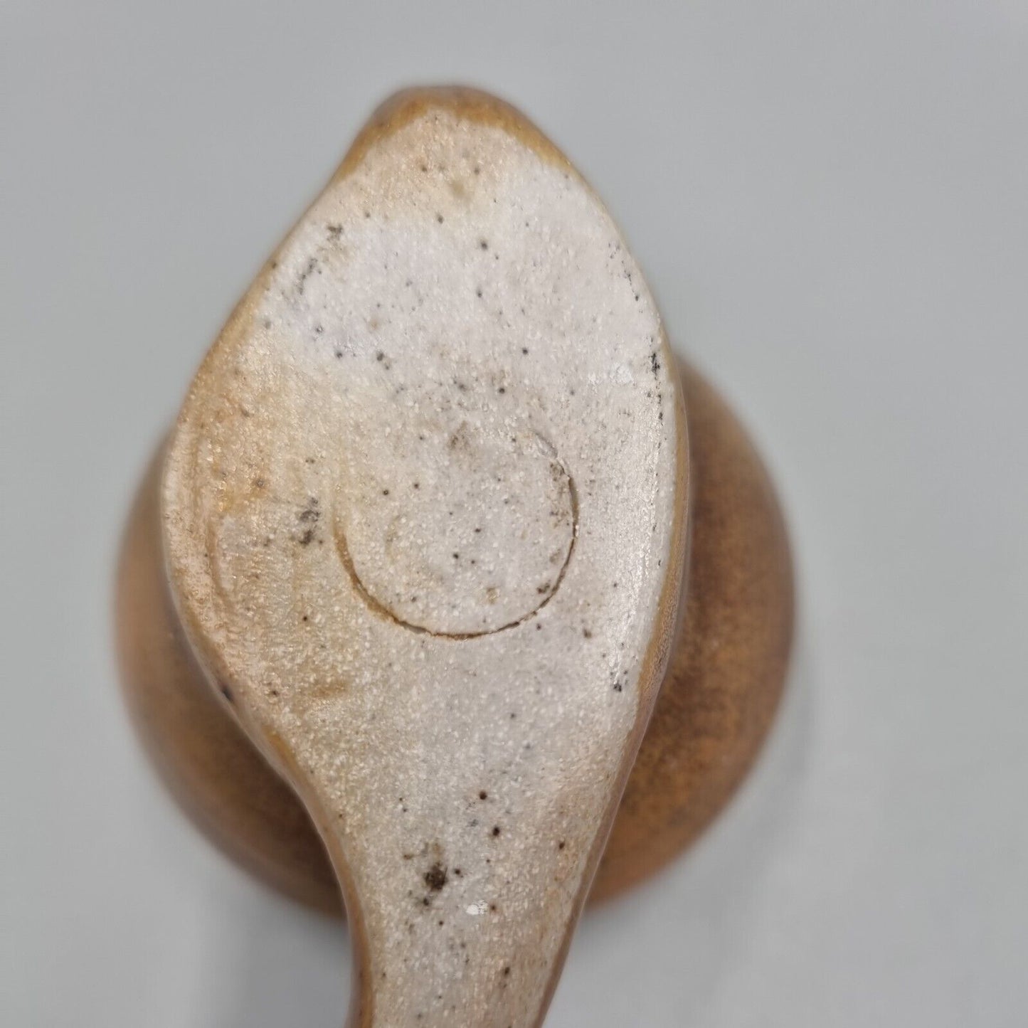 A Rowena Kinsman Studio Pottery 'Snail' Egg Cup Holder.