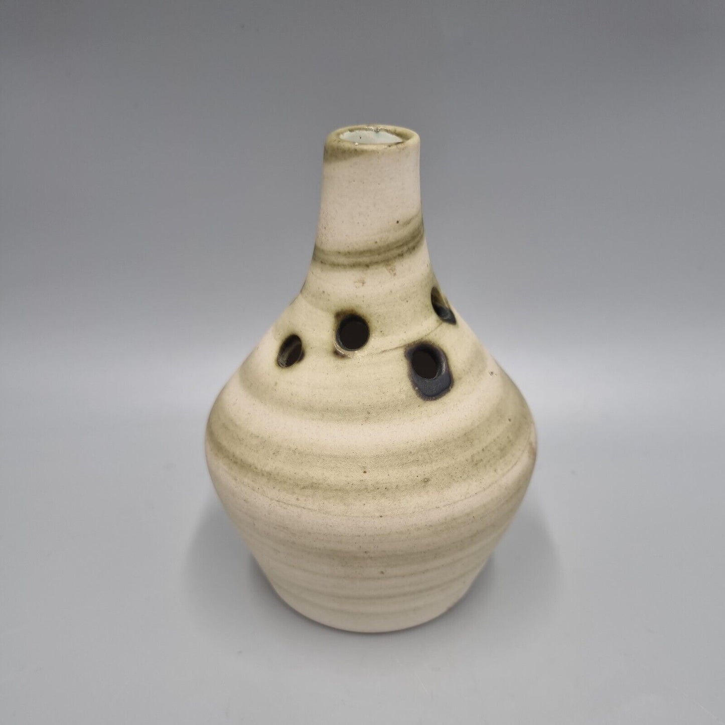 A Carn Studio Pottery Vase - John Beusmans, Round Form Bud Vase With Piercings.