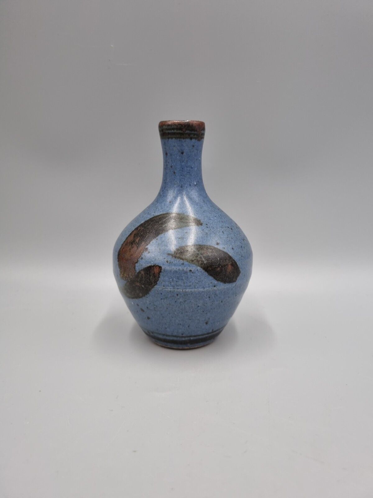 A Studio Pottery Bulb Vase By Alex Adams.