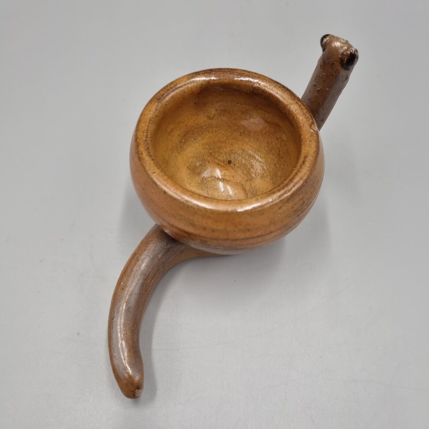 A Rowena Kinsman Studio Pottery 'Snail' Egg Cup Holder.