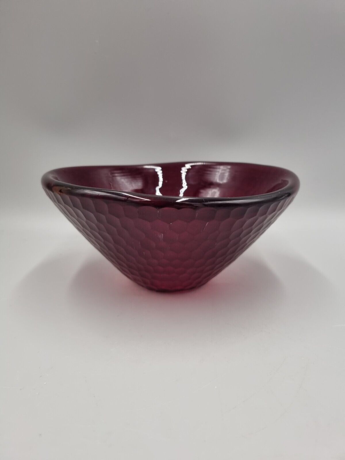 A Studio Glass Multi Faceted Red Bowl.