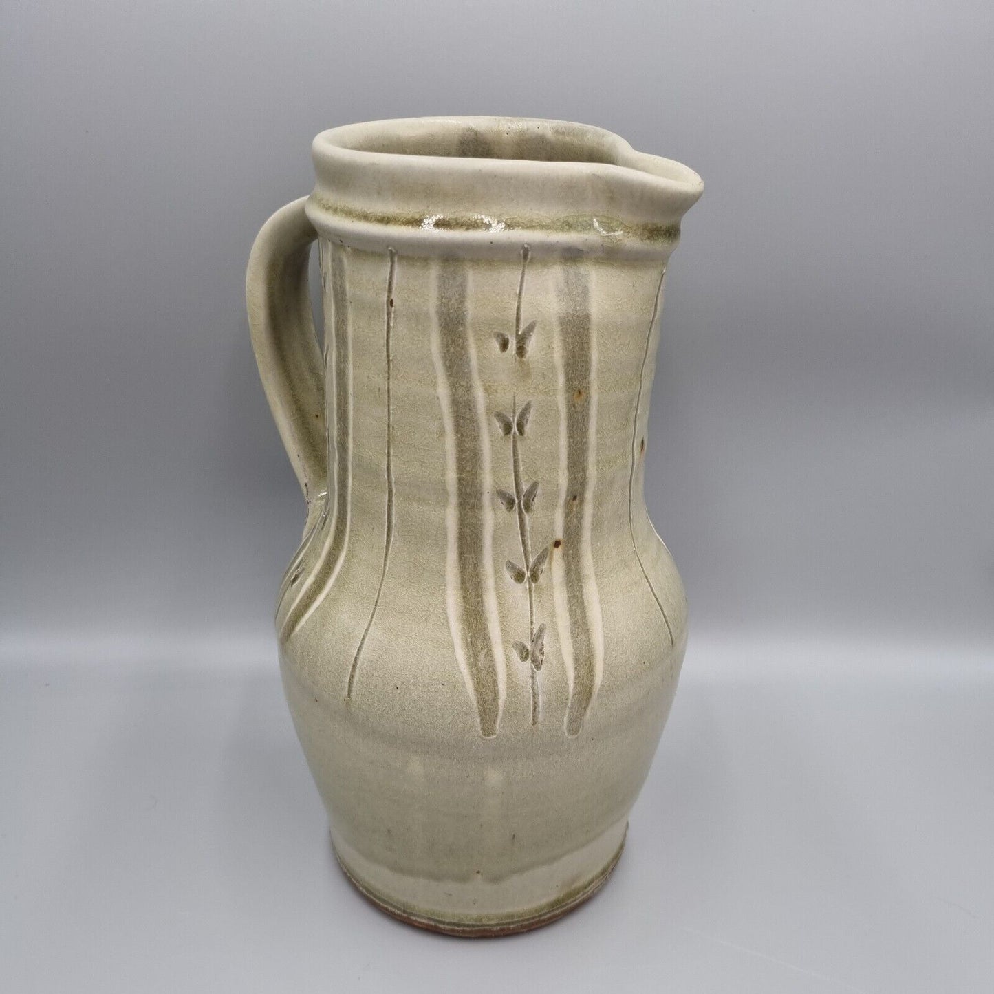 A Large Jug by Mike Dodd In Green Ash Glaze With Incised Motifs. VGC.