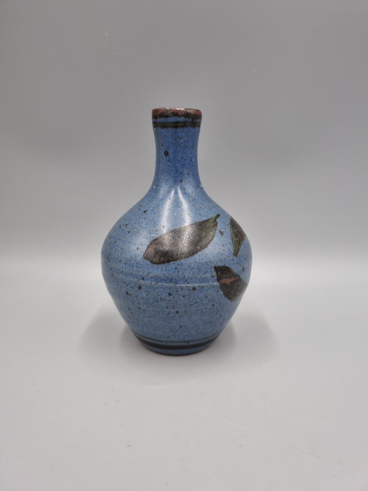 A Studio Pottery Bulb Vase By Alex Adams.