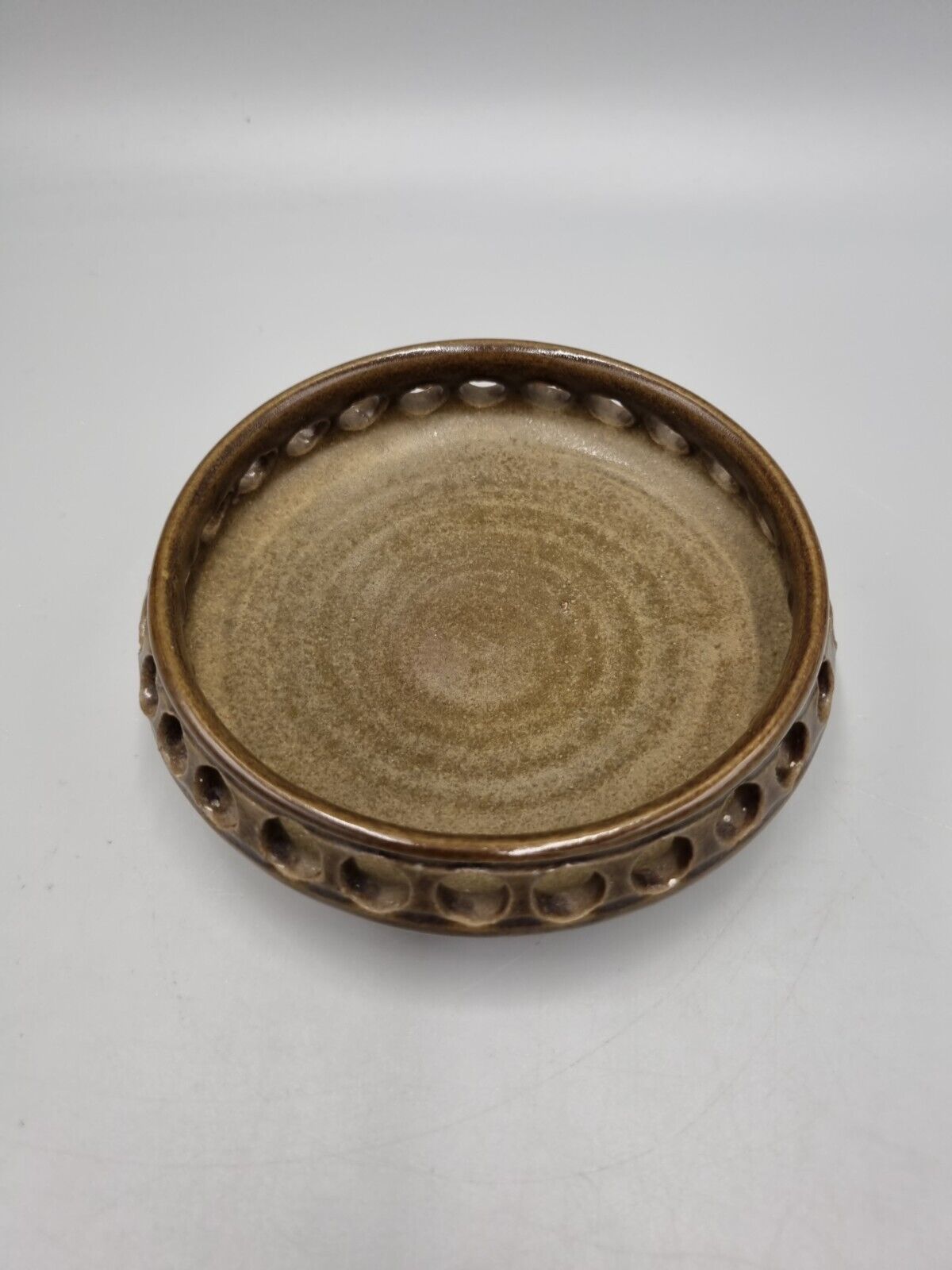 A  Studio Pottery Pierced Shallow Bowl, Impressed Flower Mark.