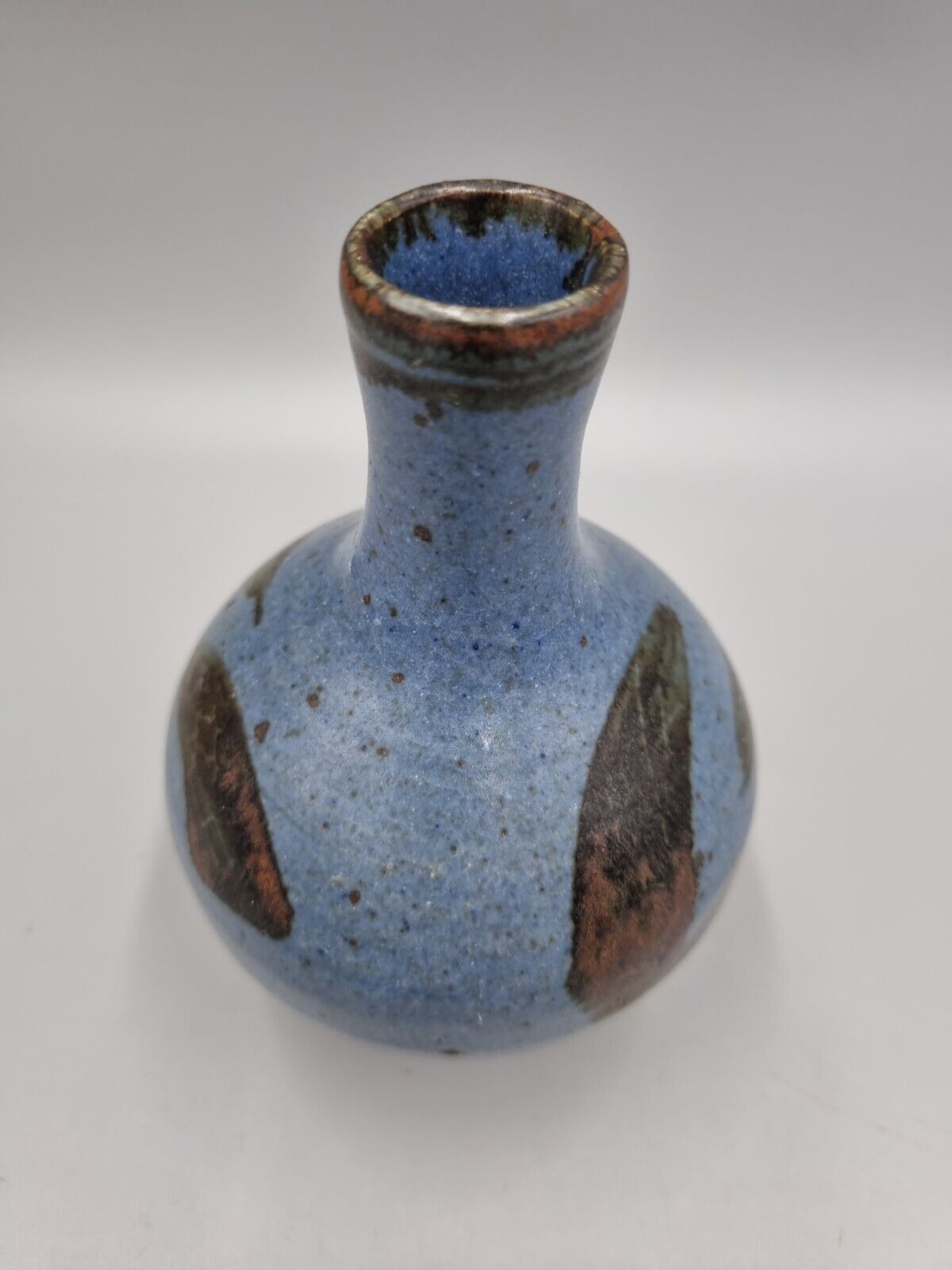 A Studio Pottery Bulb Vase By Alex Adams.