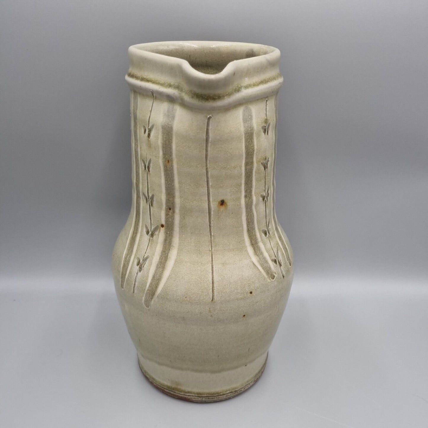 A Large Jug by Mike Dodd In Green Ash Glaze With Incised Motifs. VGC.