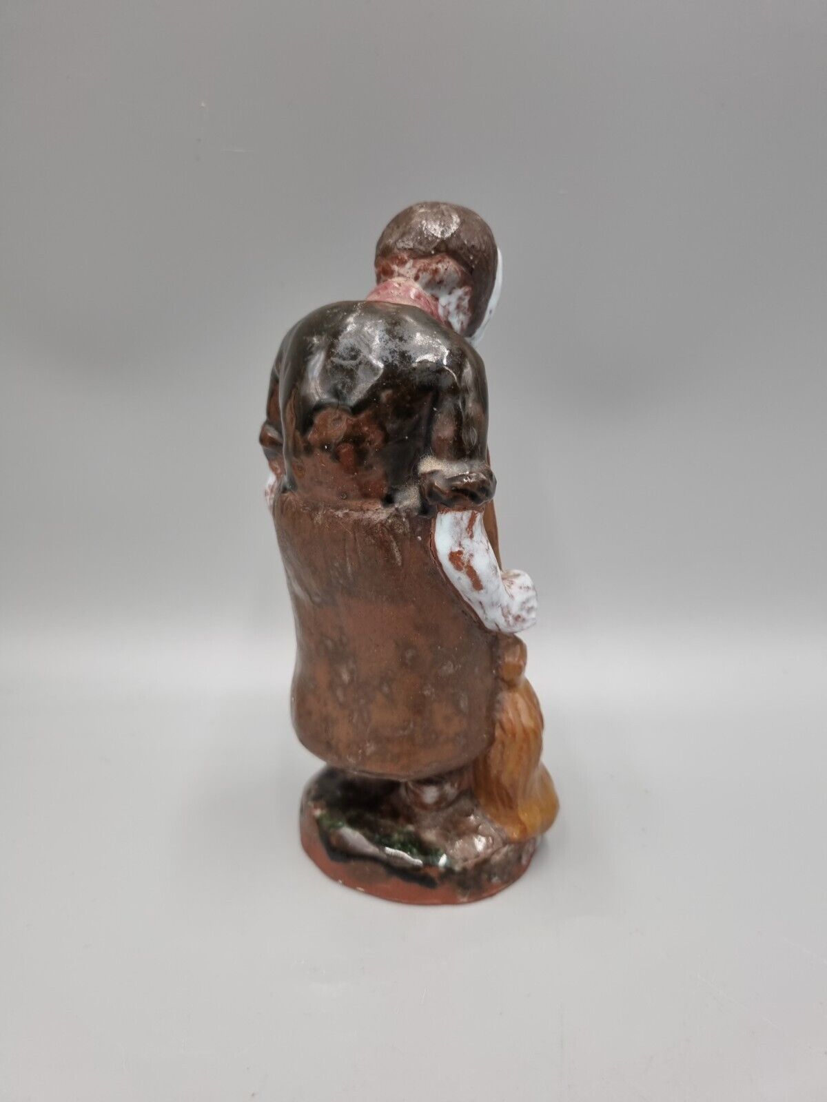 A Handmade Studio Pottery Figurine Of A Woman In Clogs, Fish markers Mark.