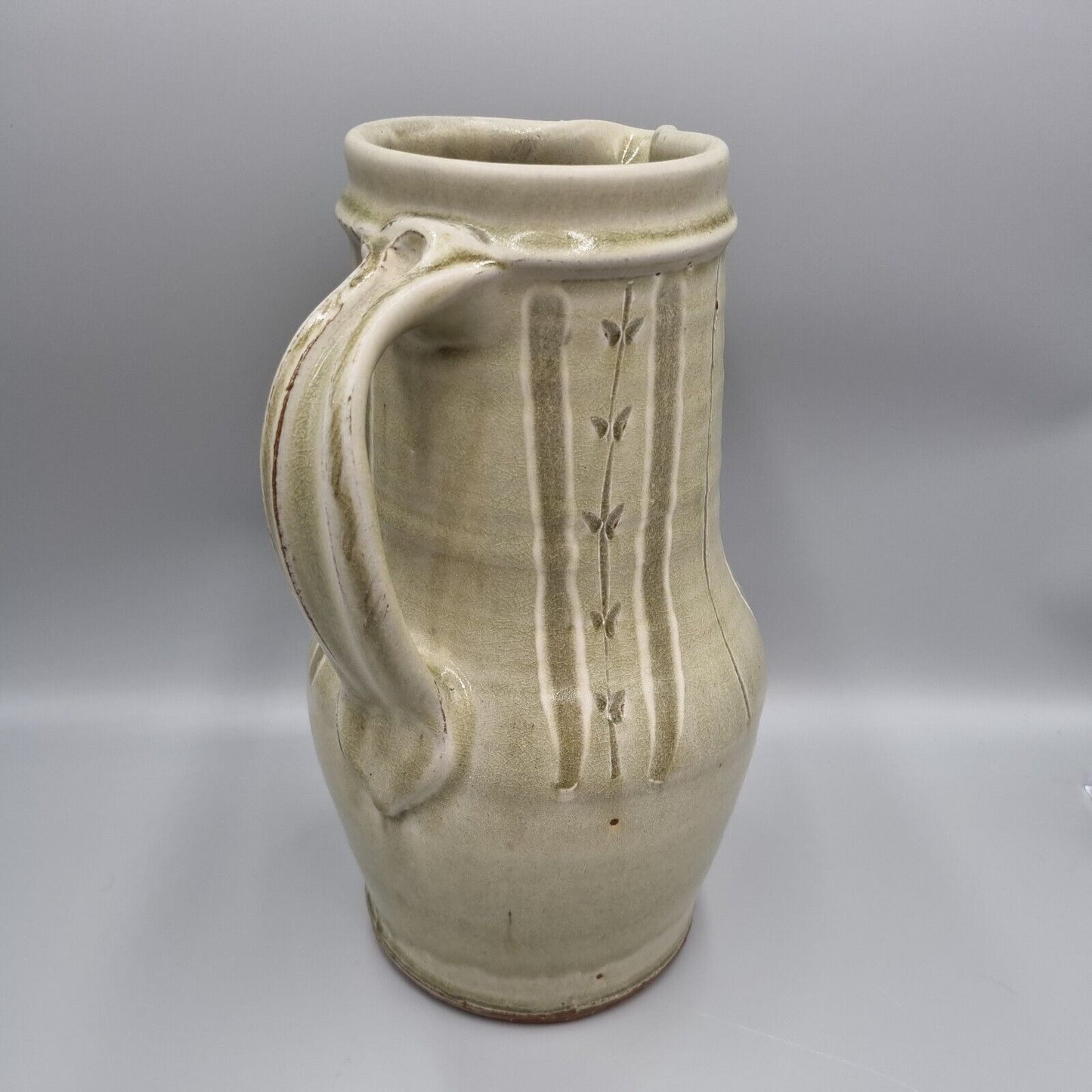 A Large Jug by Mike Dodd In Green Ash Glaze With Incised Motifs. VGC.