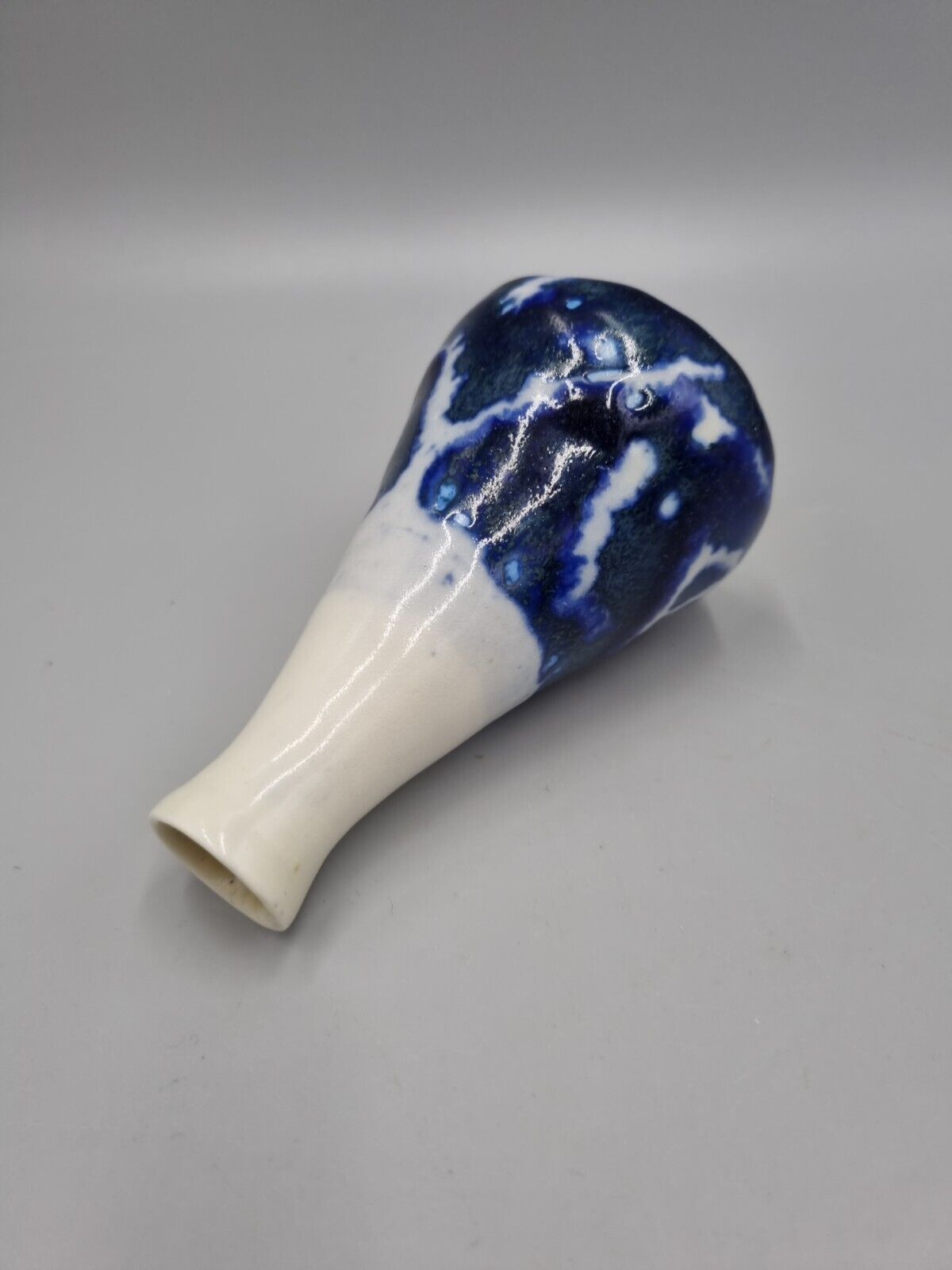 A Studio Pottery Blue & White Ceramic Conical Bud  Posy Vase. Signed 'R'.