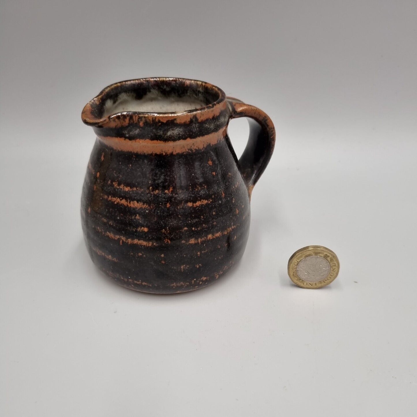 A Michael Gaitskell Of Wootton Courtenay Pottery, Somerset, Tenmoku Glazed Jug.