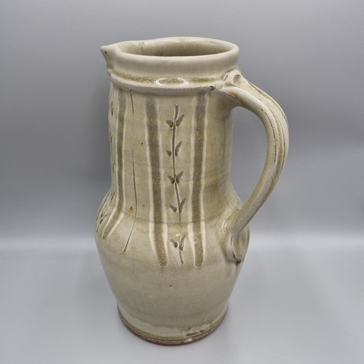 A Large Jug by Mike Dodd In Green Ash Glaze With Incised Motifs. VGC.