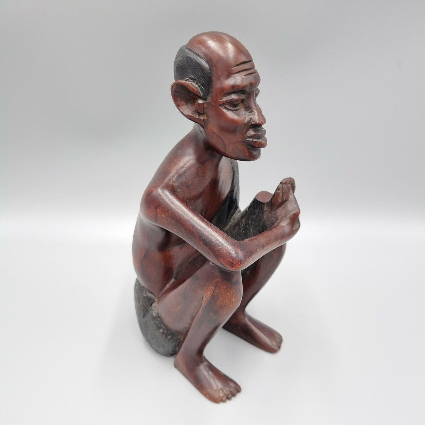 A Vintage Carved Dark Hard Wood African Seated Figure. VGC.