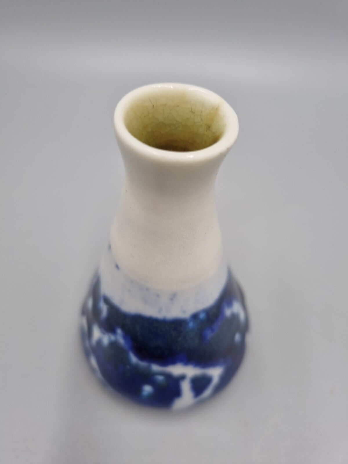 A Studio Pottery Blue & White Ceramic Conical Bud  Posy Vase. Signed 'R'.