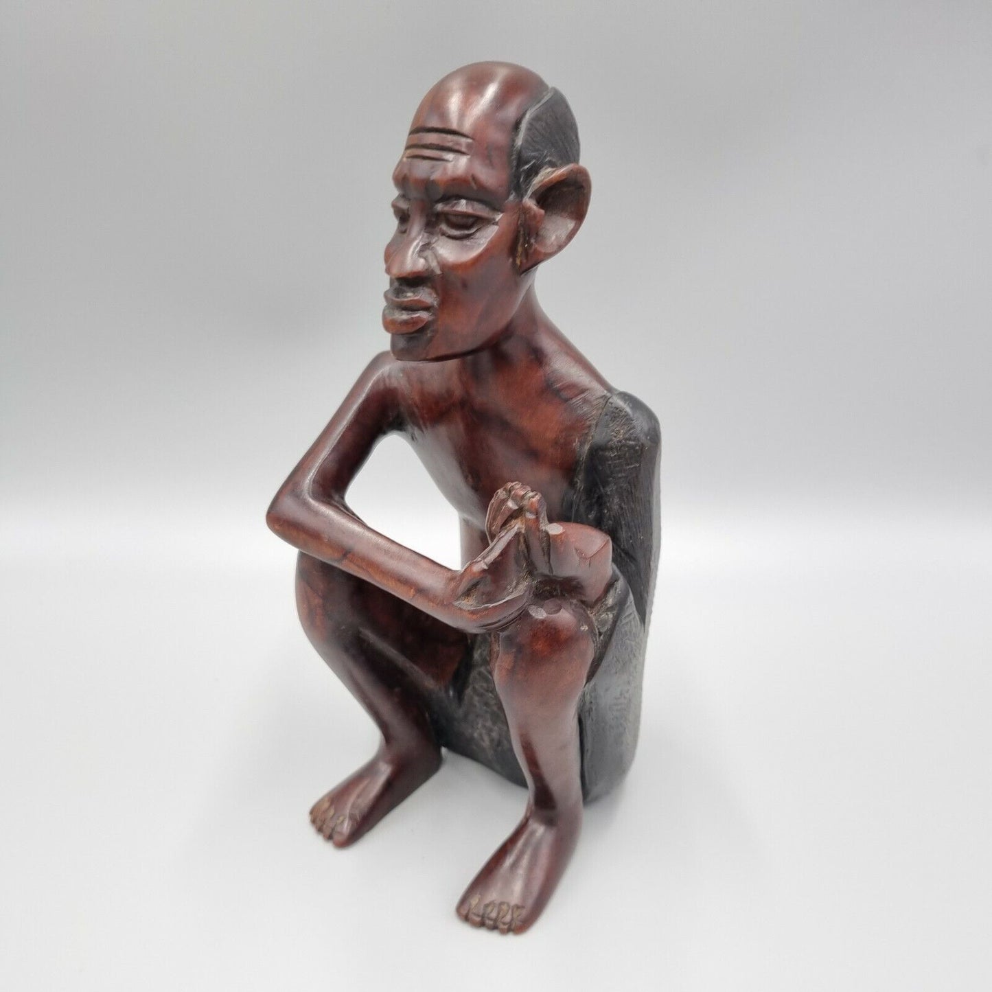 A Vintage Carved Dark Hard Wood African Seated Figure. VGC.