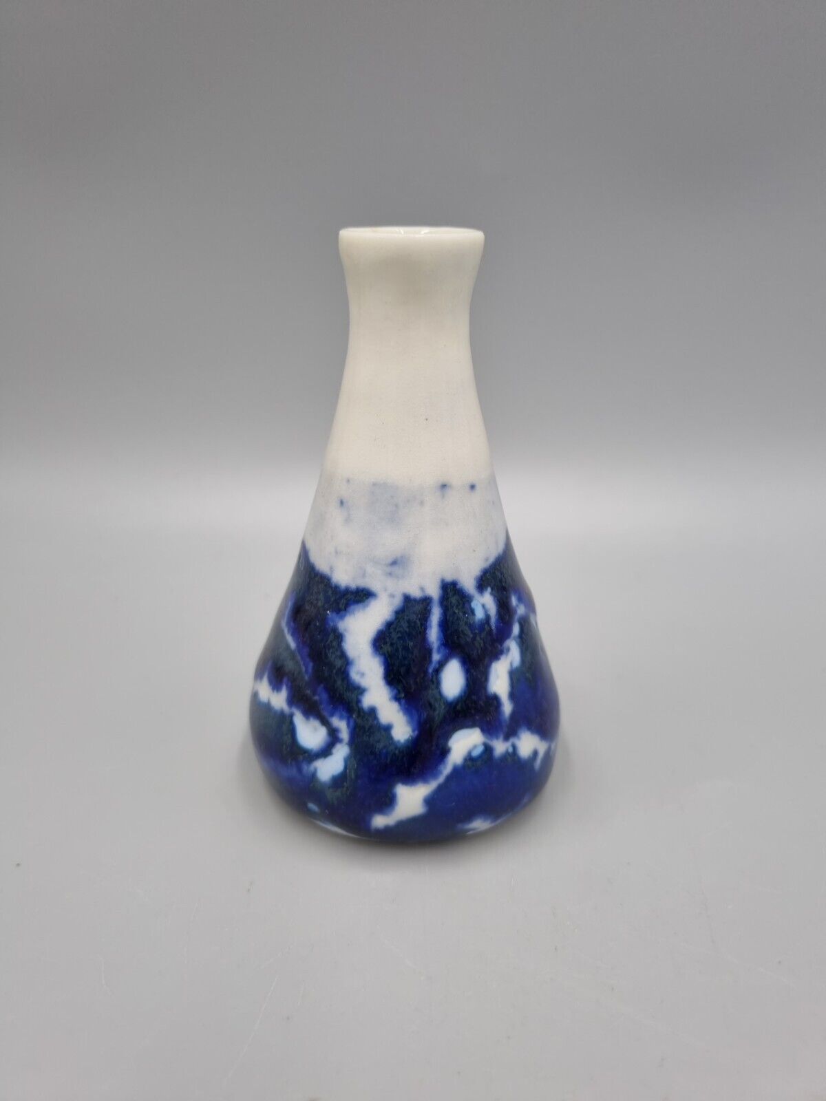 A Studio Pottery Blue & White Ceramic Conical Bud  Posy Vase. Signed 'R'.