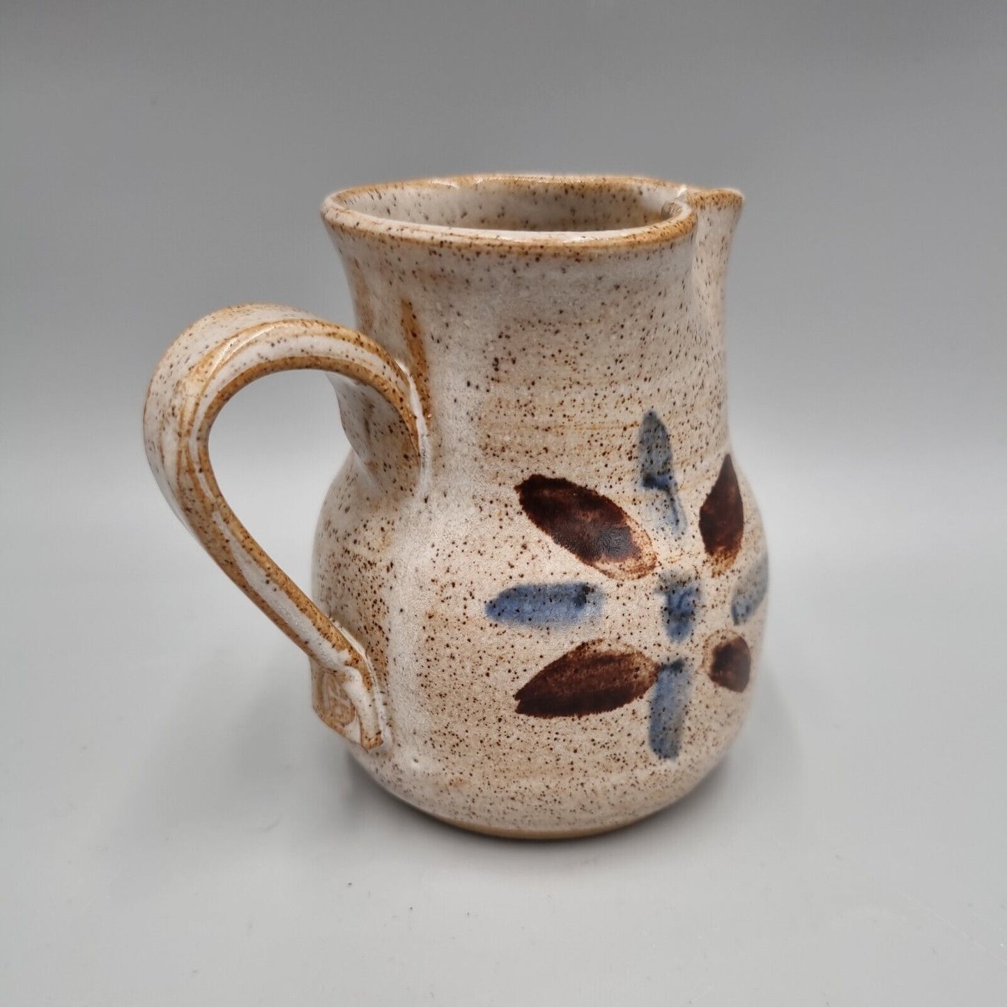 A small studio Pottery Milk Jug With Cross Mark, John Bedding?