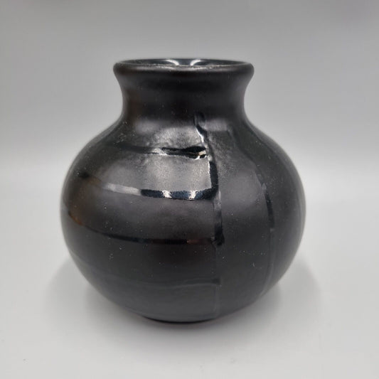 A Contemporary Poole Pottery, Black Glaze Bud / Posy Vase. Initial 'FL'.