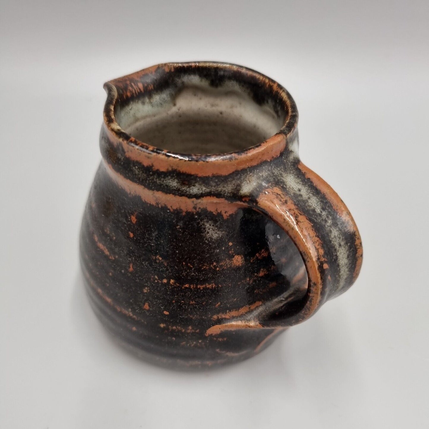 A Michael Gaitskell Of Wootton Courtenay Pottery, Somerset, Tenmoku Glazed Jug.