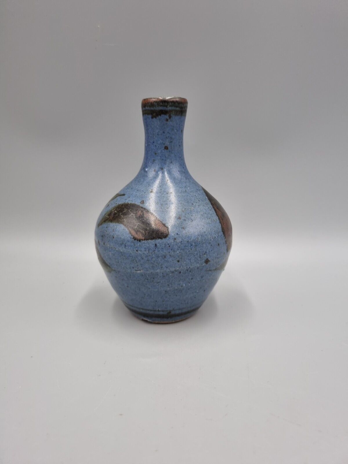 A Studio Pottery Bulb Vase By Alex Adams.