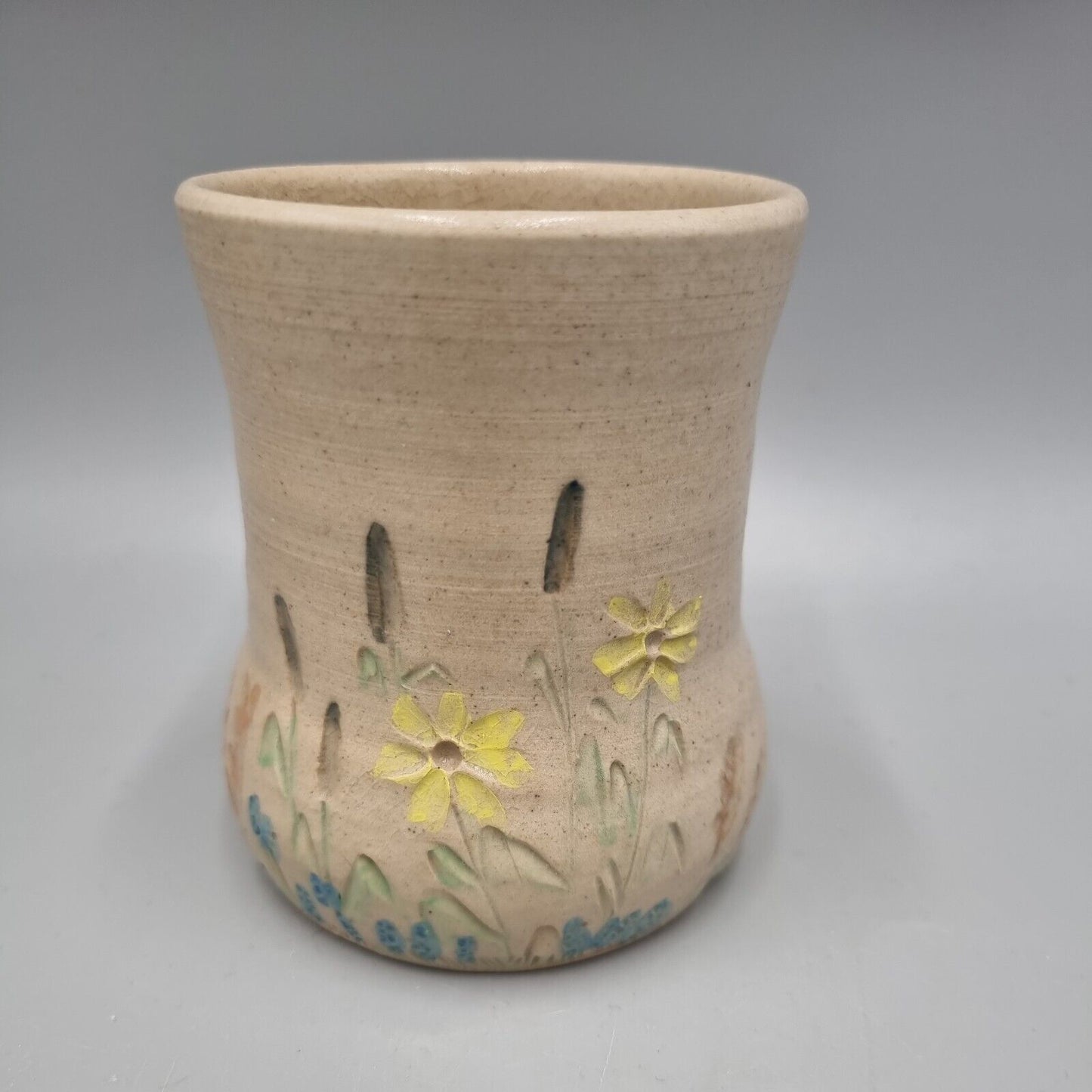 A Studio Pottery Vase With Impressed Flower Decoration, Marked To Base.