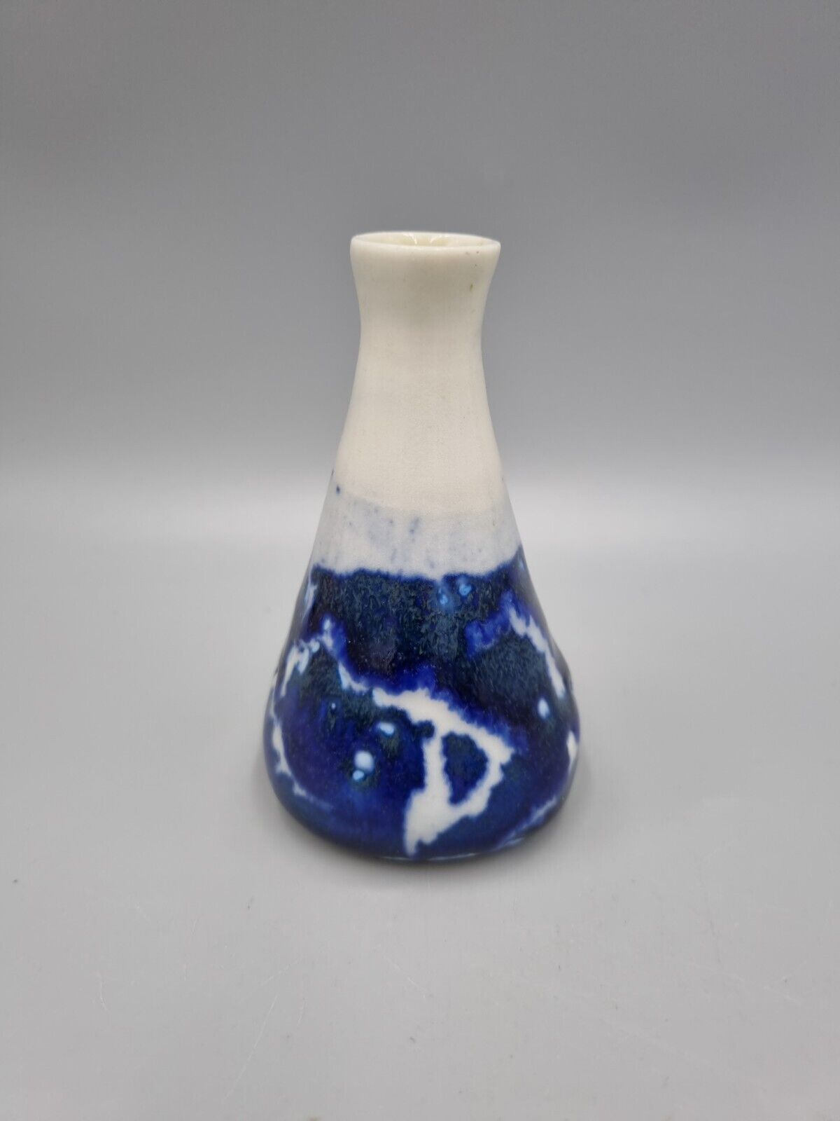 A Studio Pottery Blue & White Ceramic Conical Bud  Posy Vase. Signed 'R'.