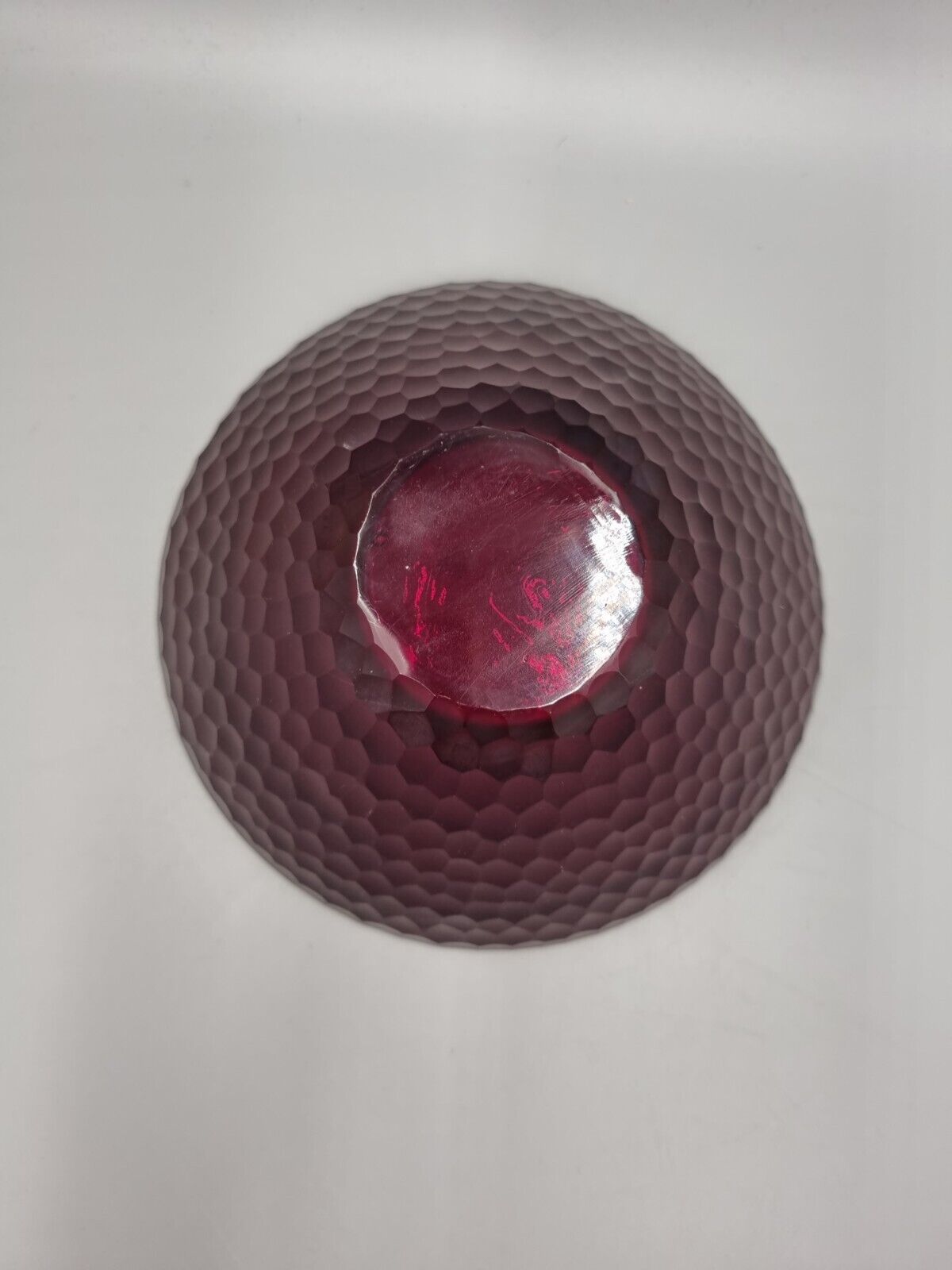 A Studio Glass Multi Faceted Red Bowl.