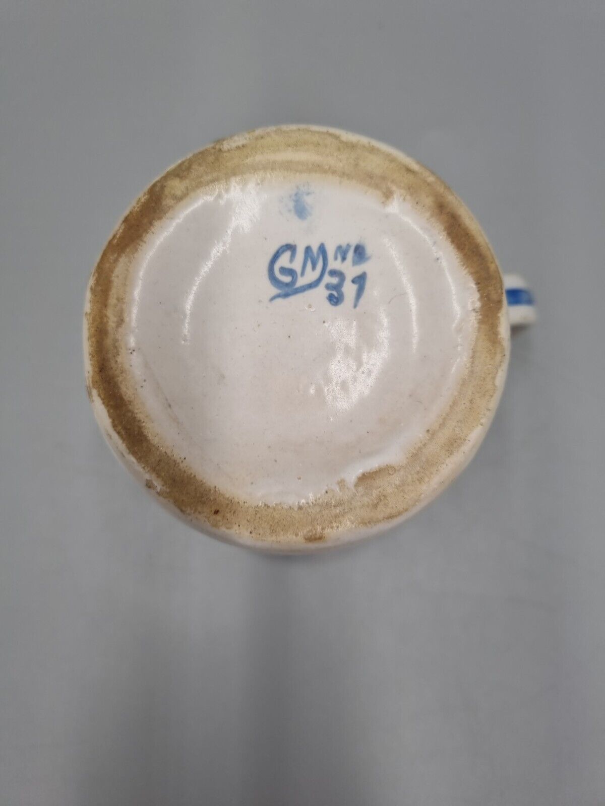 A Vintage Pottery Blue And White Jug / Creamer, Marked 'GM 37'.