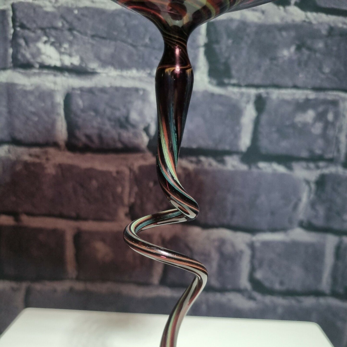 A single twisted stem art glass studio pedestal in deep purple / Amethyst.