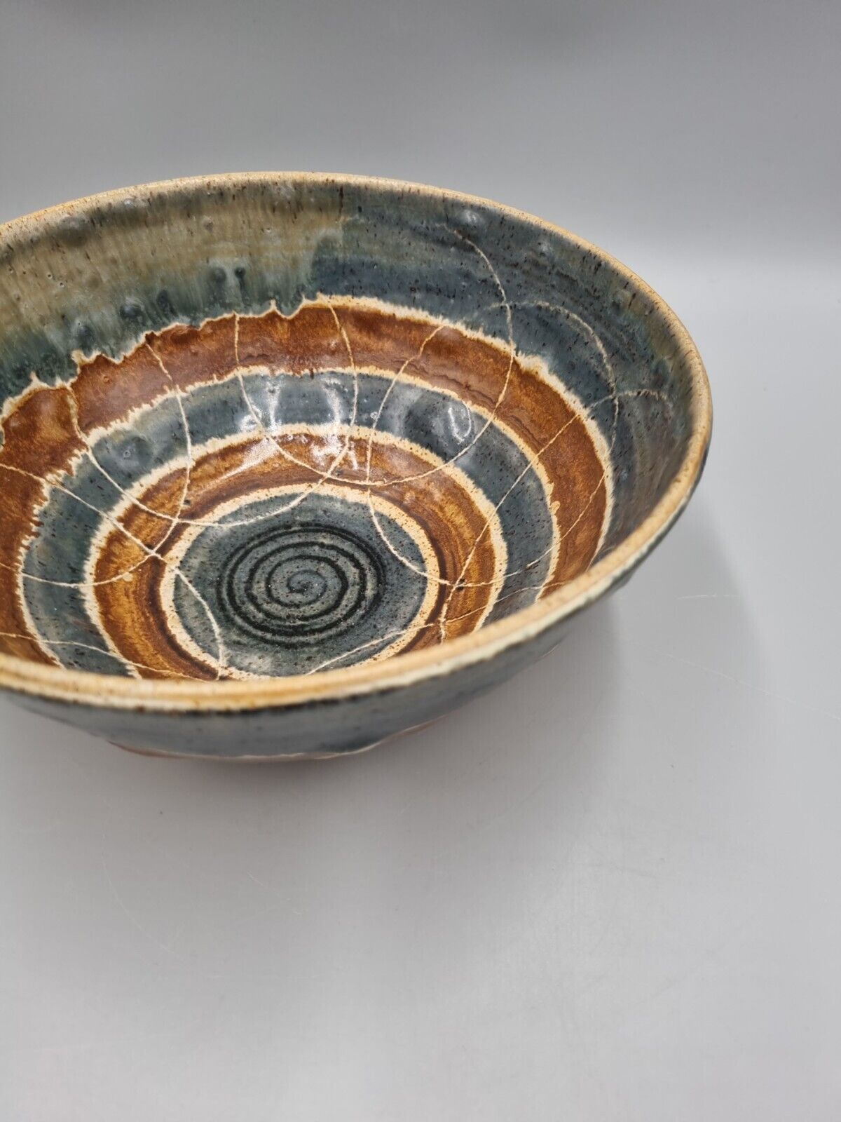 A Large Studio Pottery Bowl With Geometric Decoration, Signed 'CJ' to base.