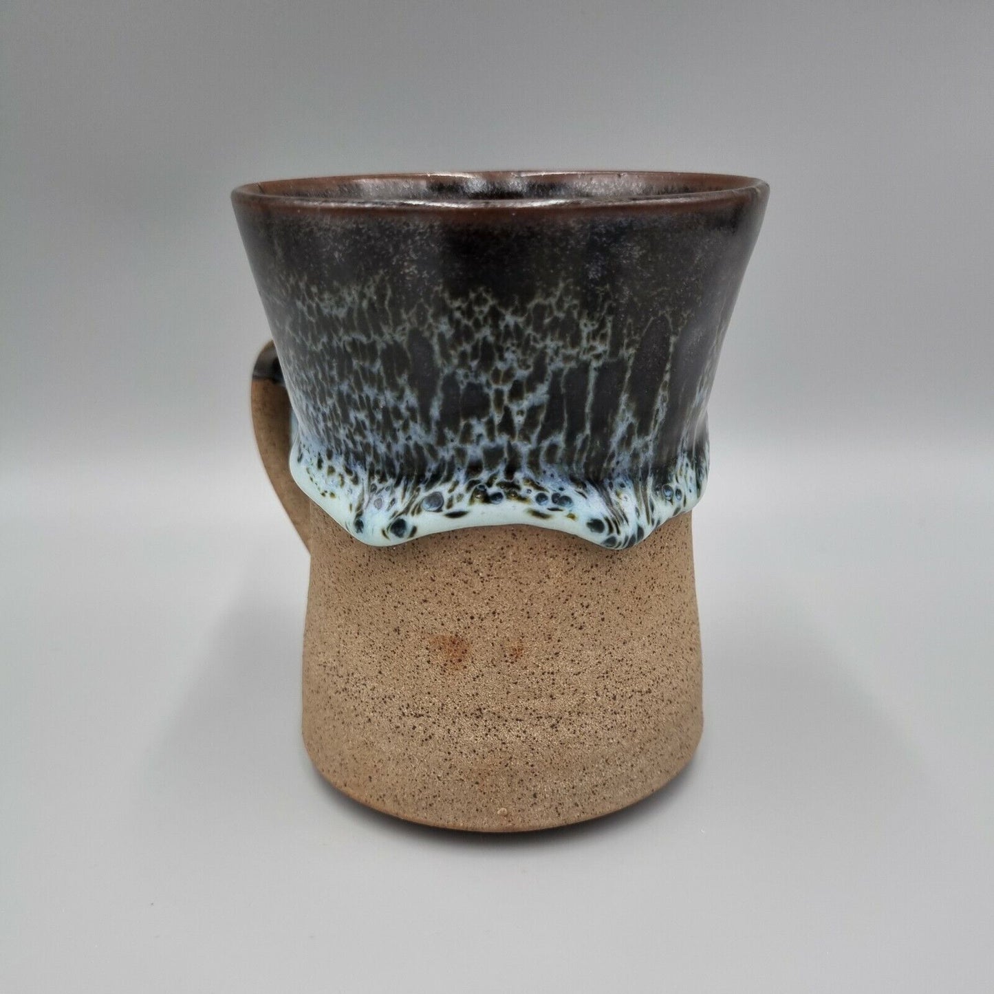 Pint Tankard Studio Pottery with heavy drip glaze. Makers mark to the base.