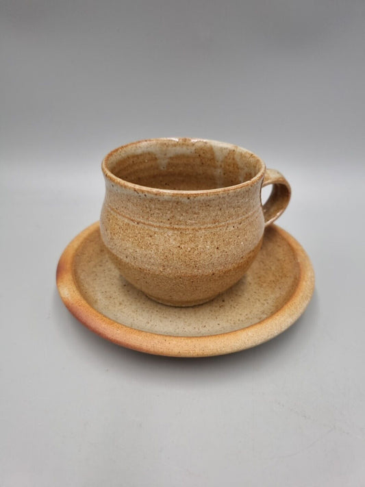 A Studio Pottery Standard Ware Cup And Saucer By Winchcombe Pottery.