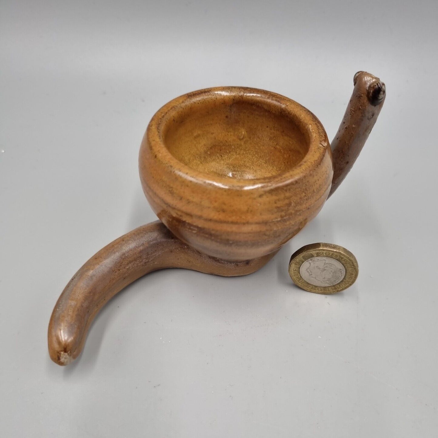 A Rowena Kinsman Studio Pottery 'Snail' Egg Cup Holder.