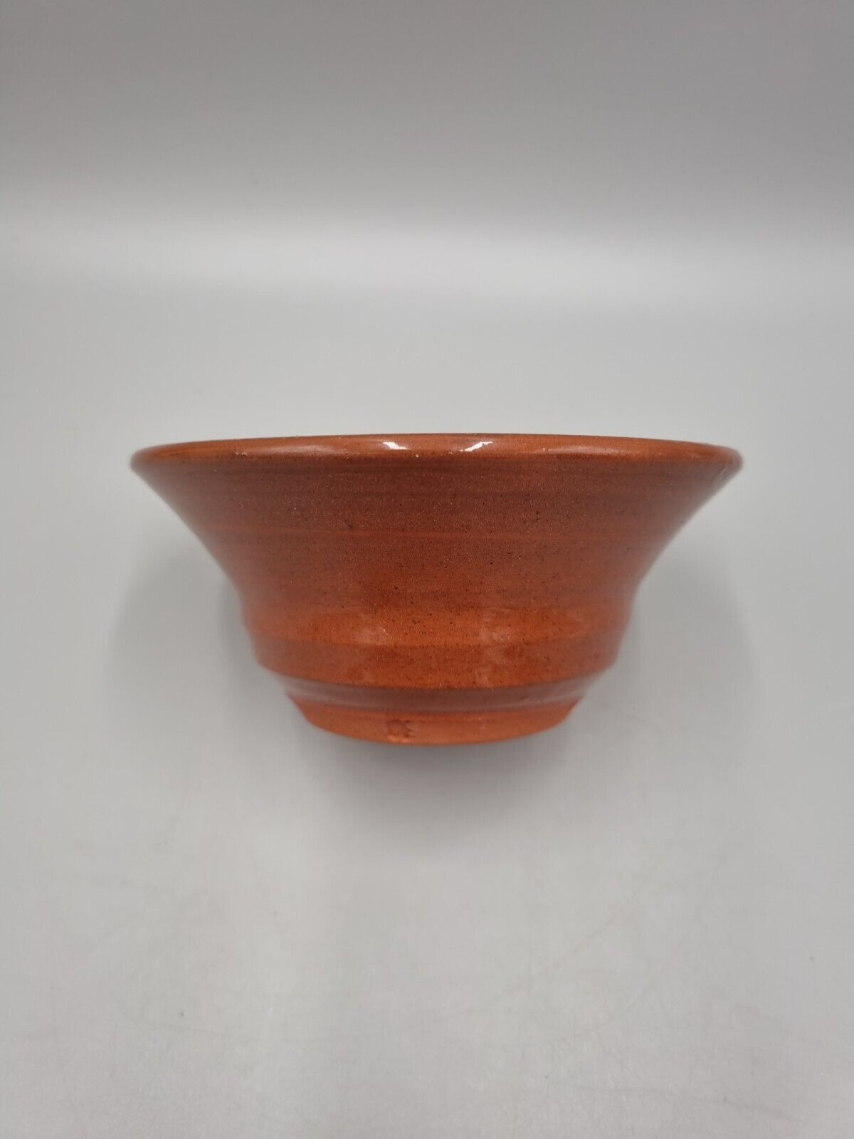 A Slip Ware Decorated Small Studio Pottery Bowl With Makers Mark.