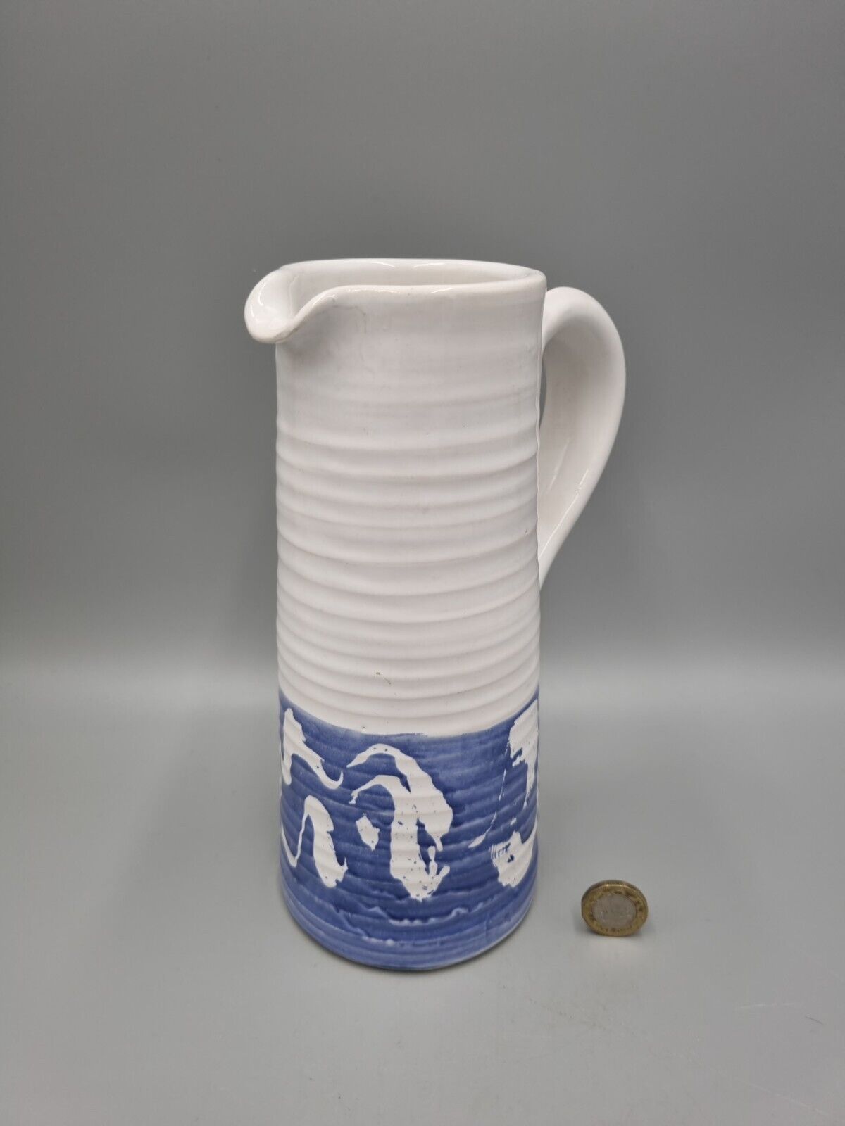 A Tall Studio Pottery Ribbed Jug / Pitcher, Unmarked.