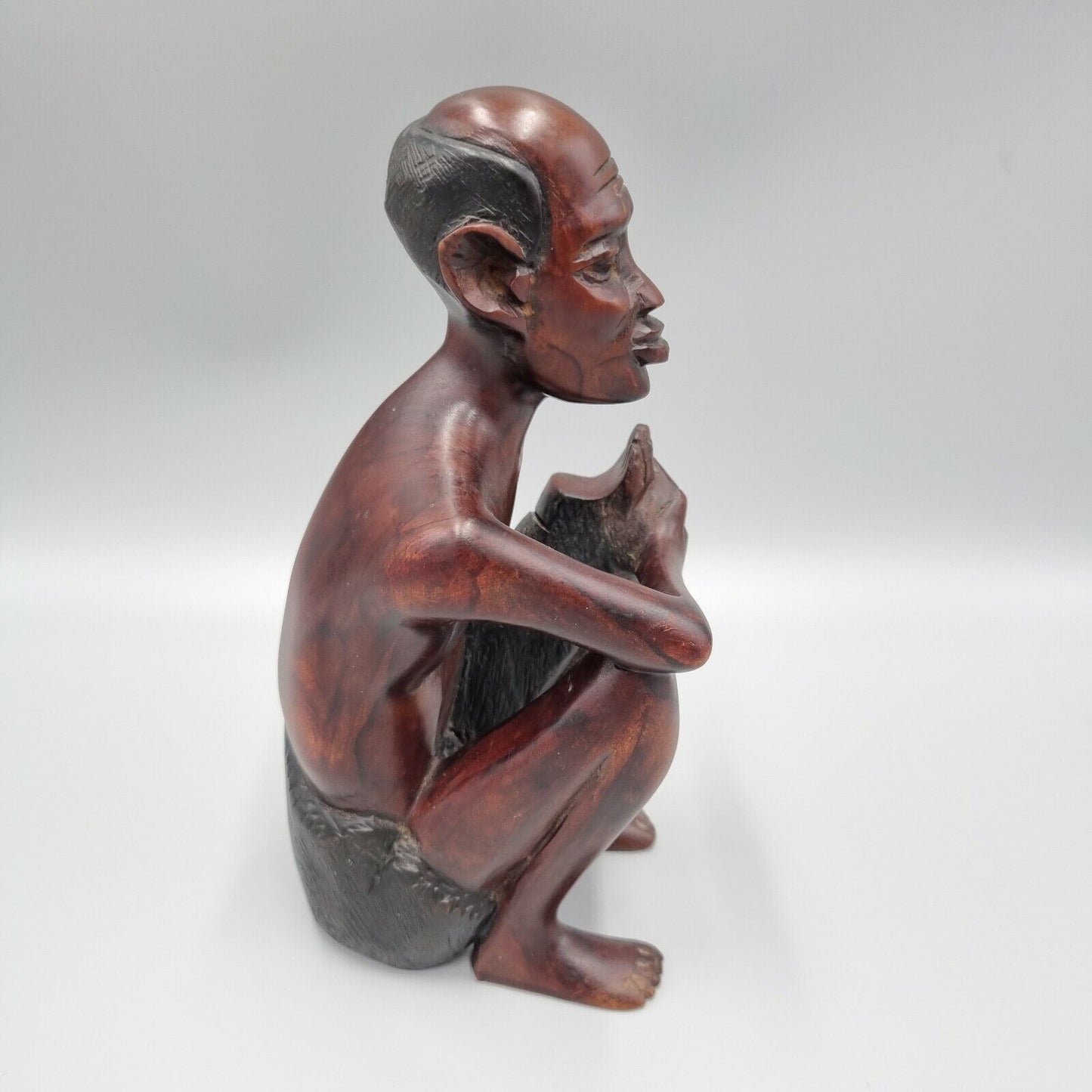 A Vintage Carved Dark Hard Wood African Seated Figure. VGC.