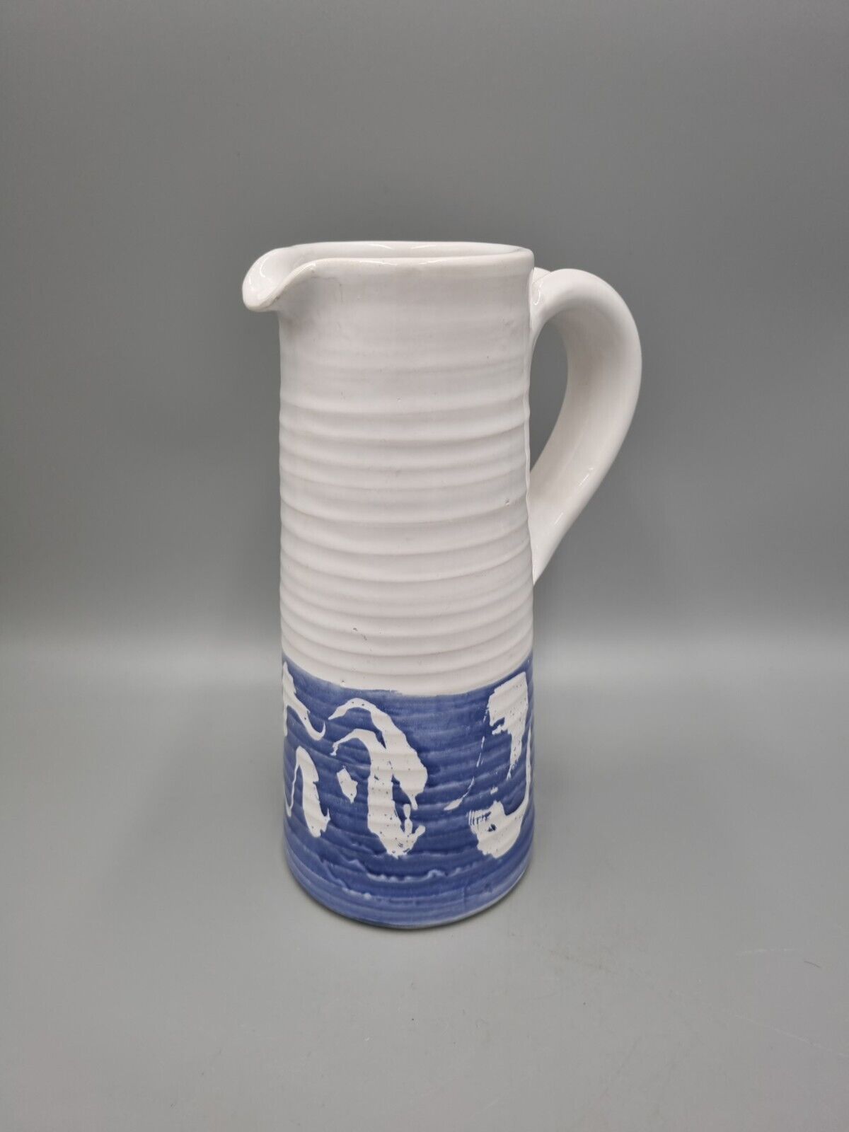 A Tall Studio Pottery Ribbed Jug / Pitcher, Unmarked.