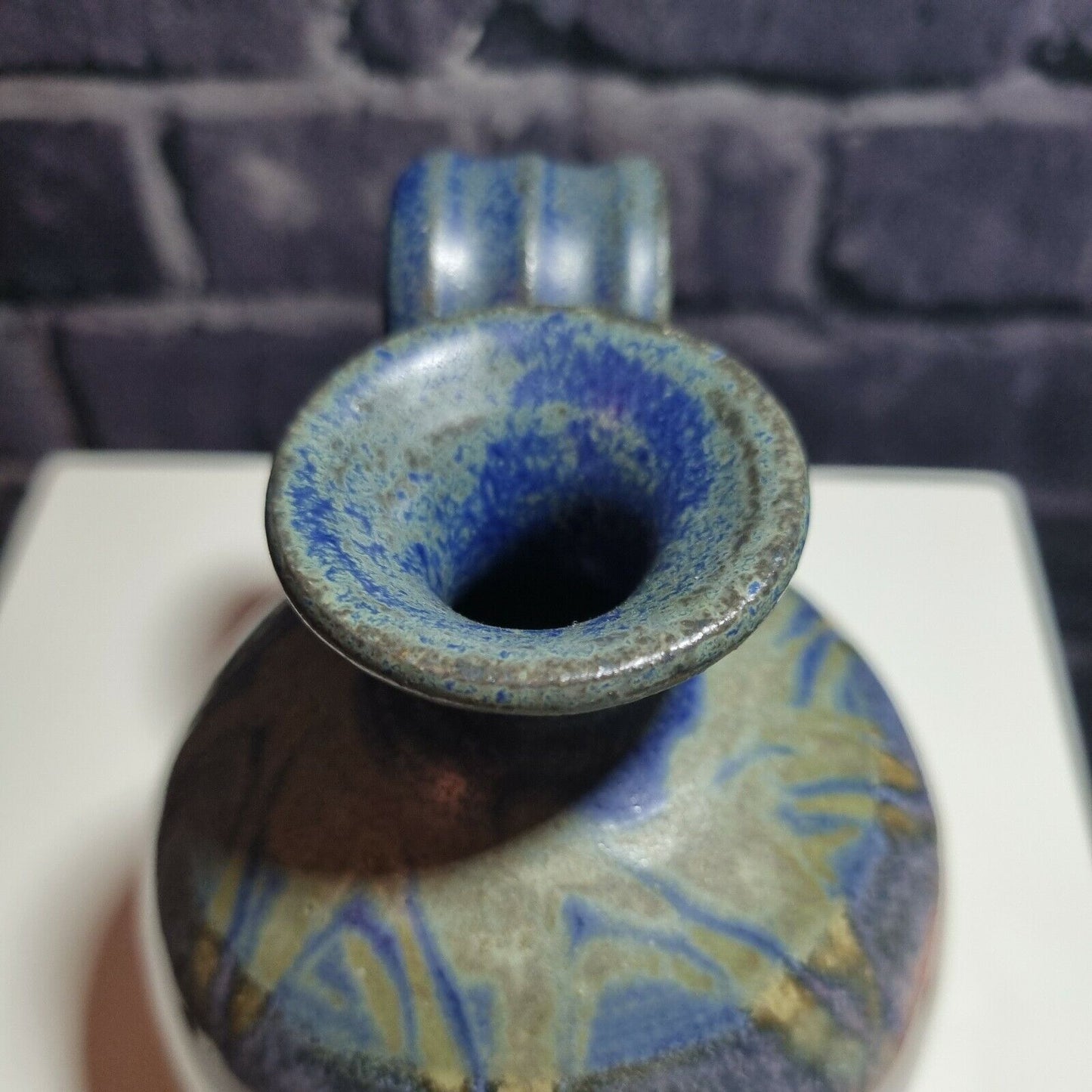 A Studio Pottery Vase with Scrolled Handle with unknown makers mark.