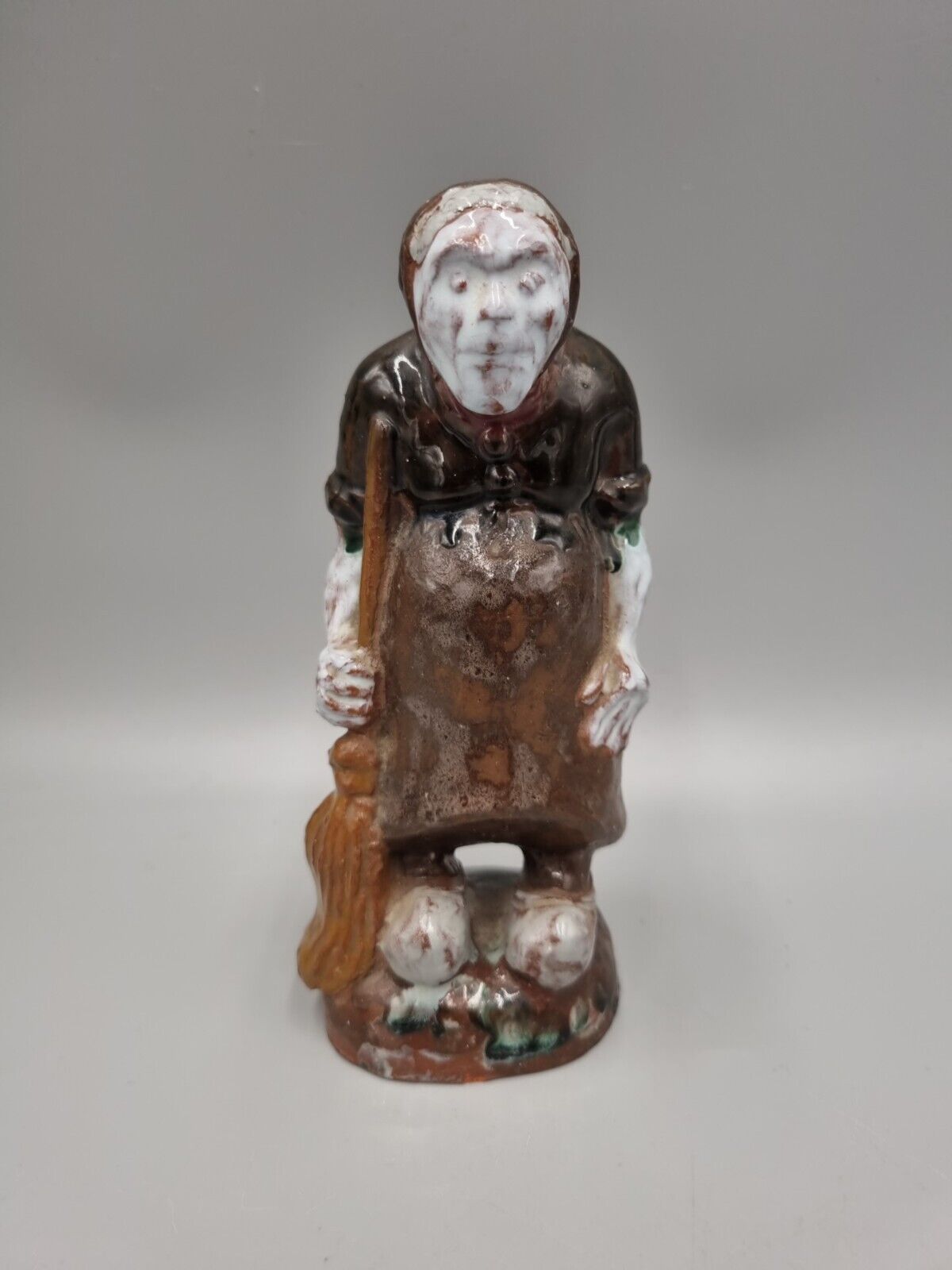 A Handmade Studio Pottery Figurine Of A Woman In Clogs, Fish markers Mark.