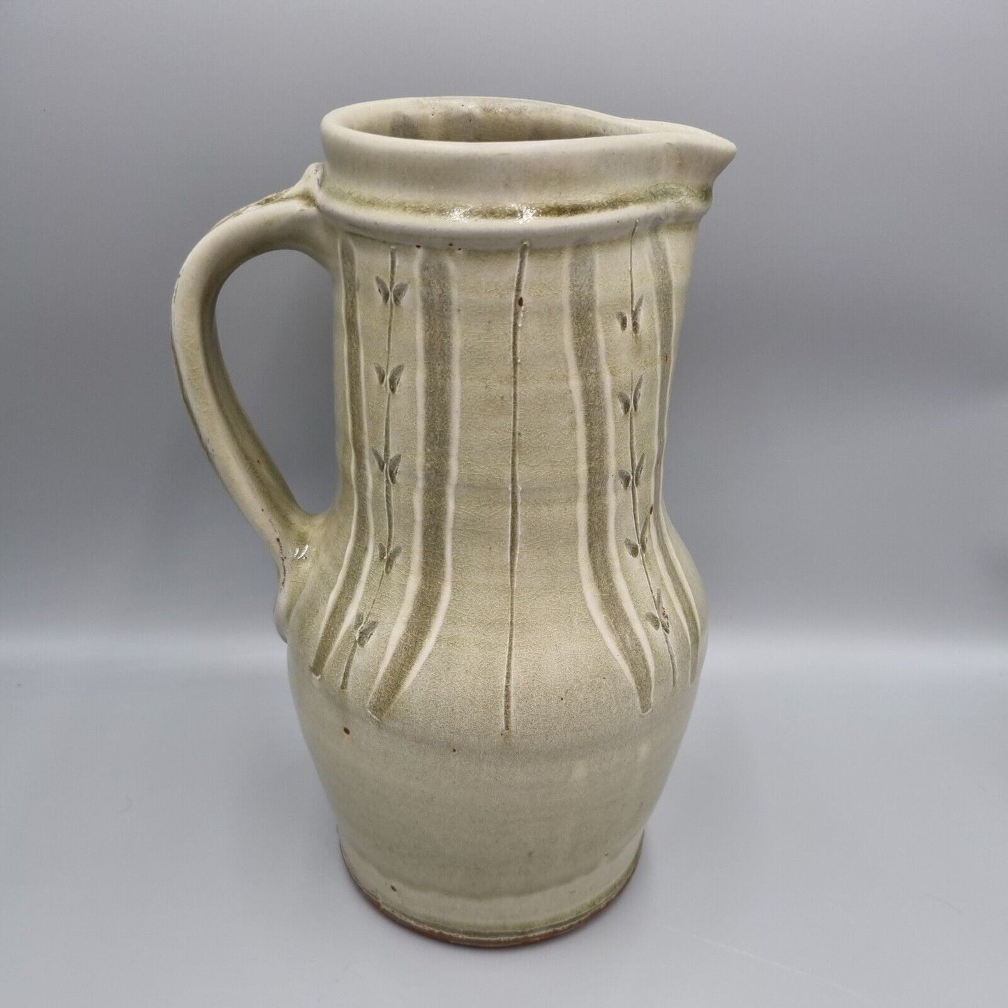 A Large Jug by Mike Dodd In Green Ash Glaze With Incised Motifs. VGC.