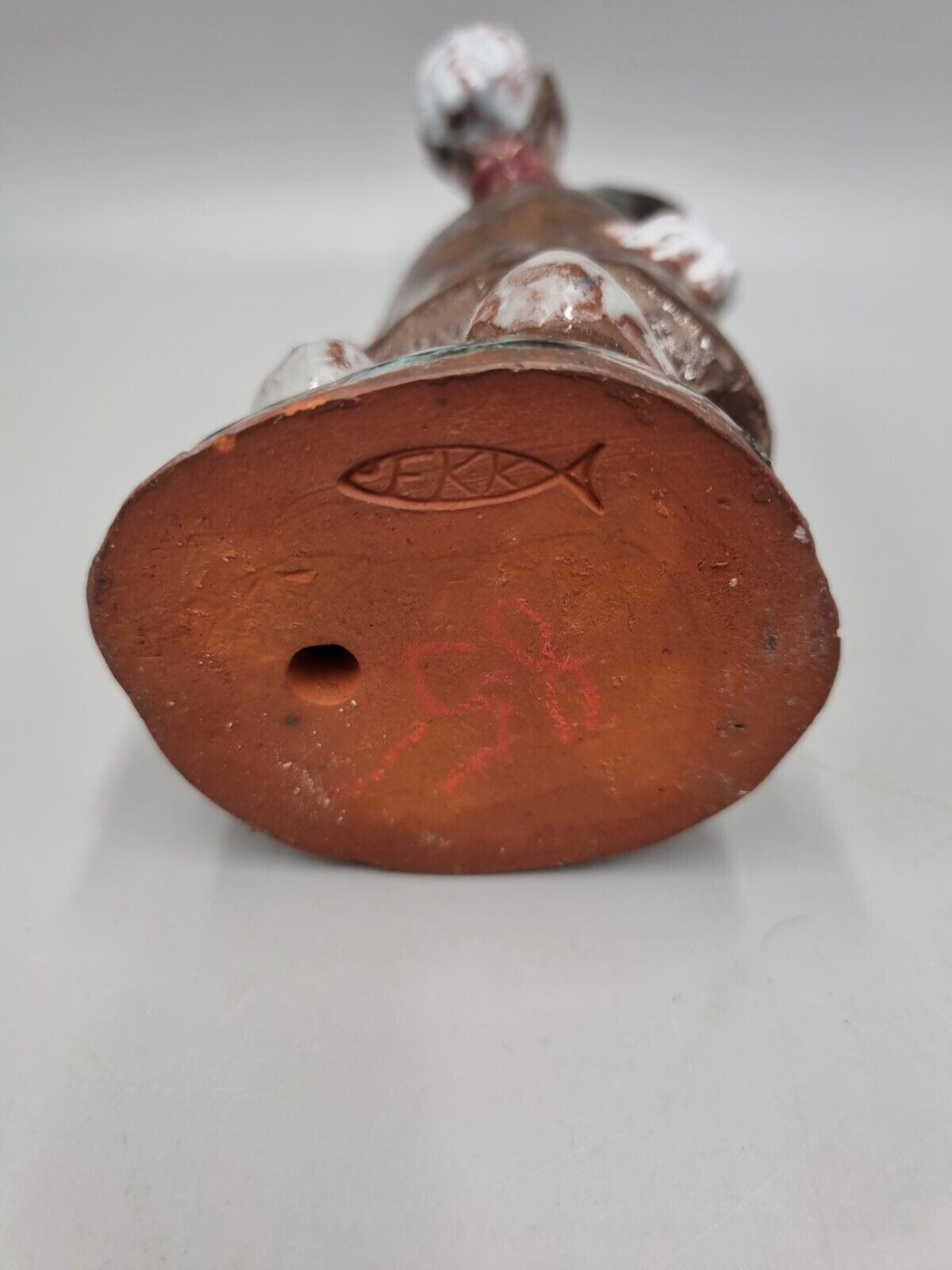 A Handmade Studio Pottery Figurine Of A Woman In Clogs, Fish markers Mark.