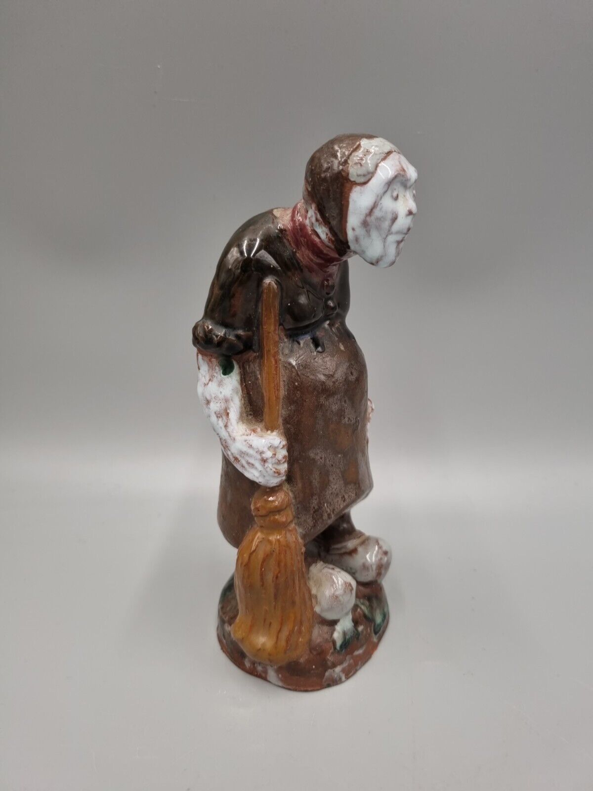 A Handmade Studio Pottery Figurine Of A Woman In Clogs, Fish markers Mark.