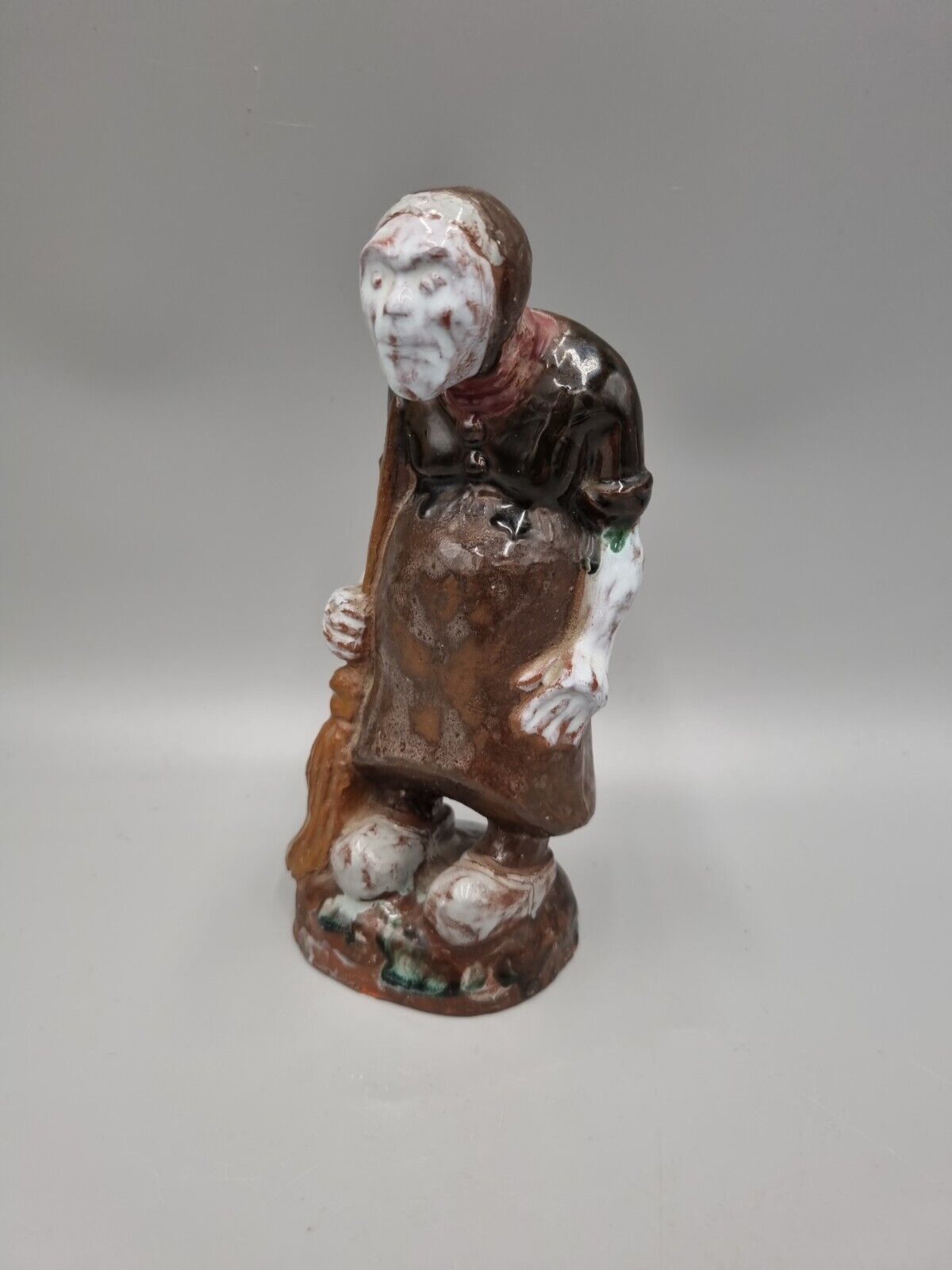 A Handmade Studio Pottery Figurine Of A Woman In Clogs, Fish markers Mark.