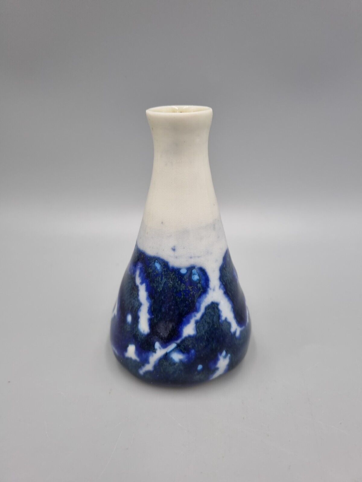 A Studio Pottery Blue & White Ceramic Conical Bud  Posy Vase. Signed 'R'.