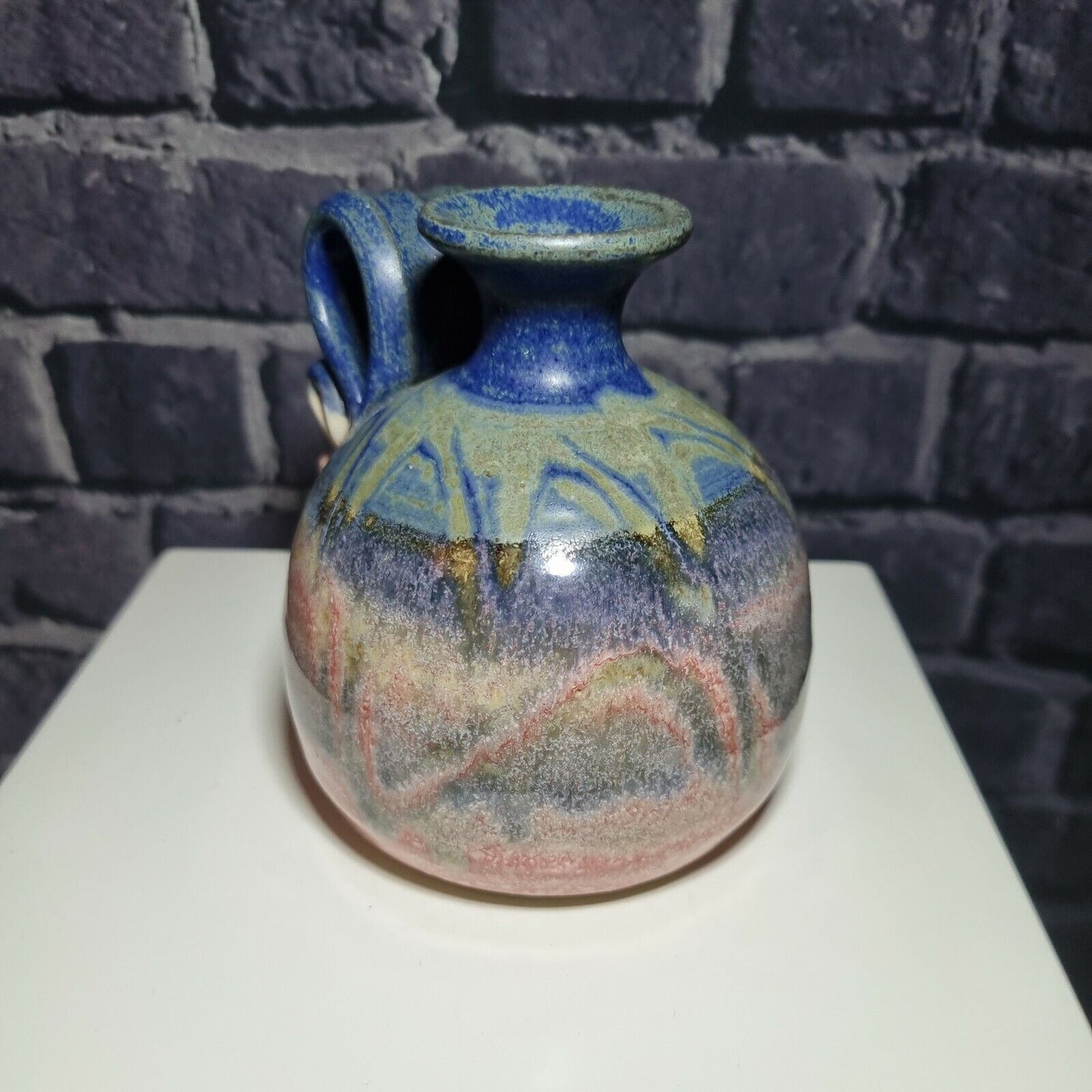 A Studio Pottery Vase with Scrolled Handle with unknown makers mark.